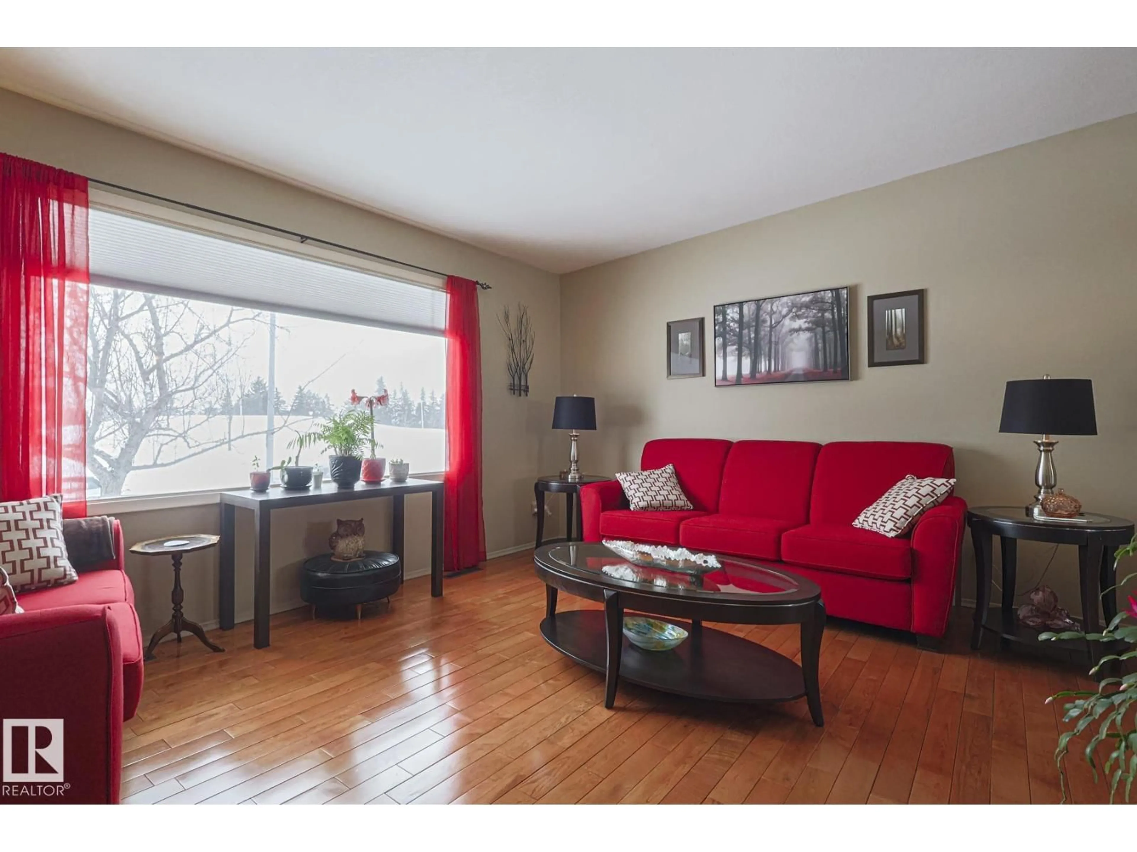 Living room with furniture, wood/laminate floor for 7604 DELWOOD RD, Edmonton Alberta T5C3B1