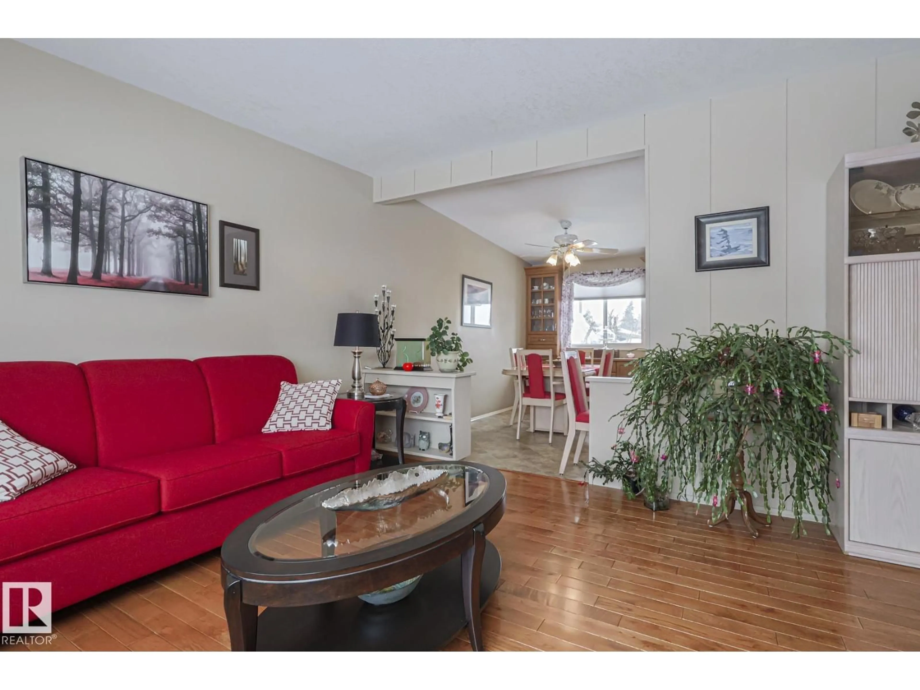 Living room with furniture, wood/laminate floor for 7604 DELWOOD RD, Edmonton Alberta T5C3B1