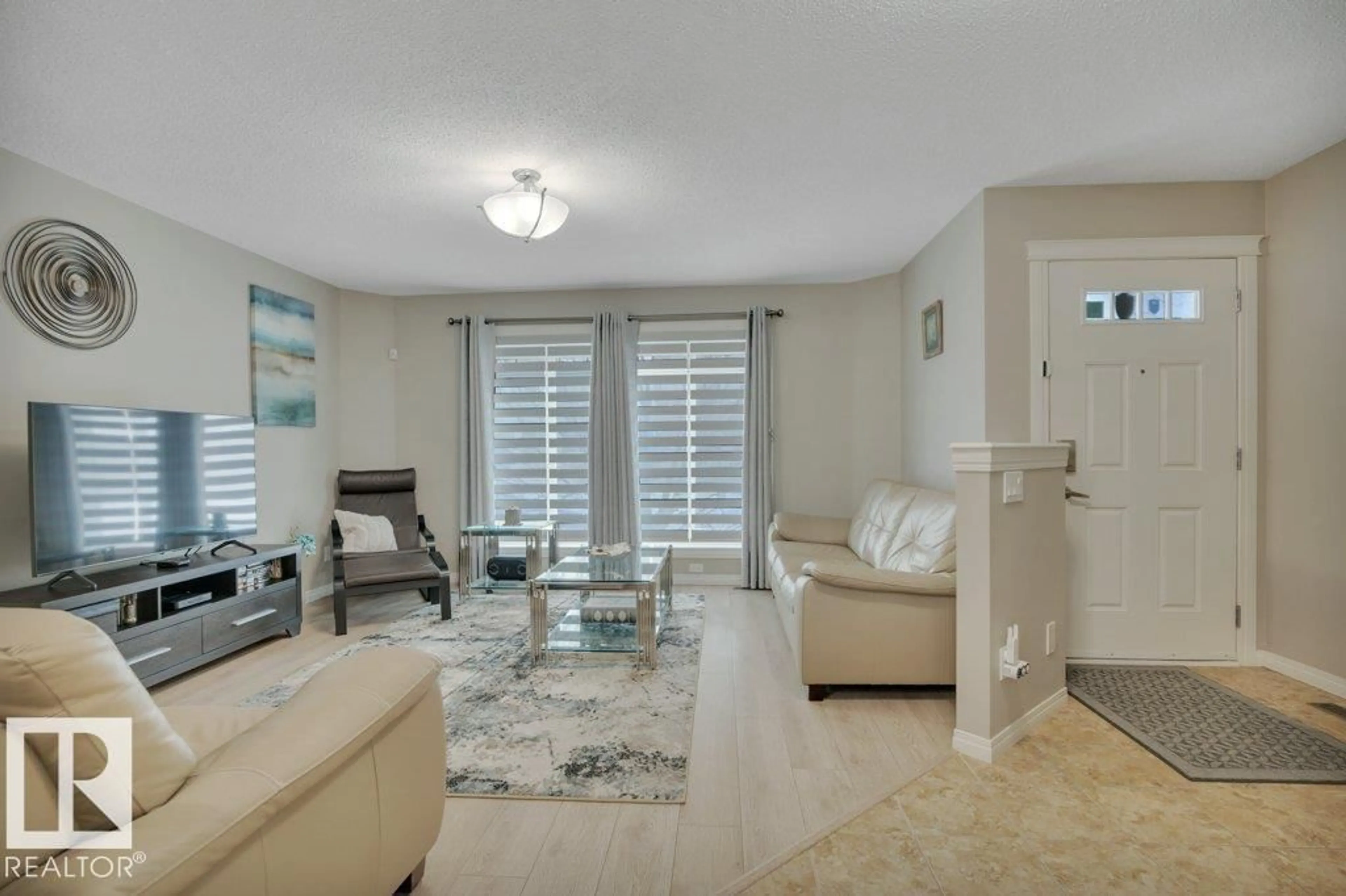 Living room with furniture, ceramic/tile floor for 1167 MCCONACHIE BV, Edmonton Alberta T5Y0T8