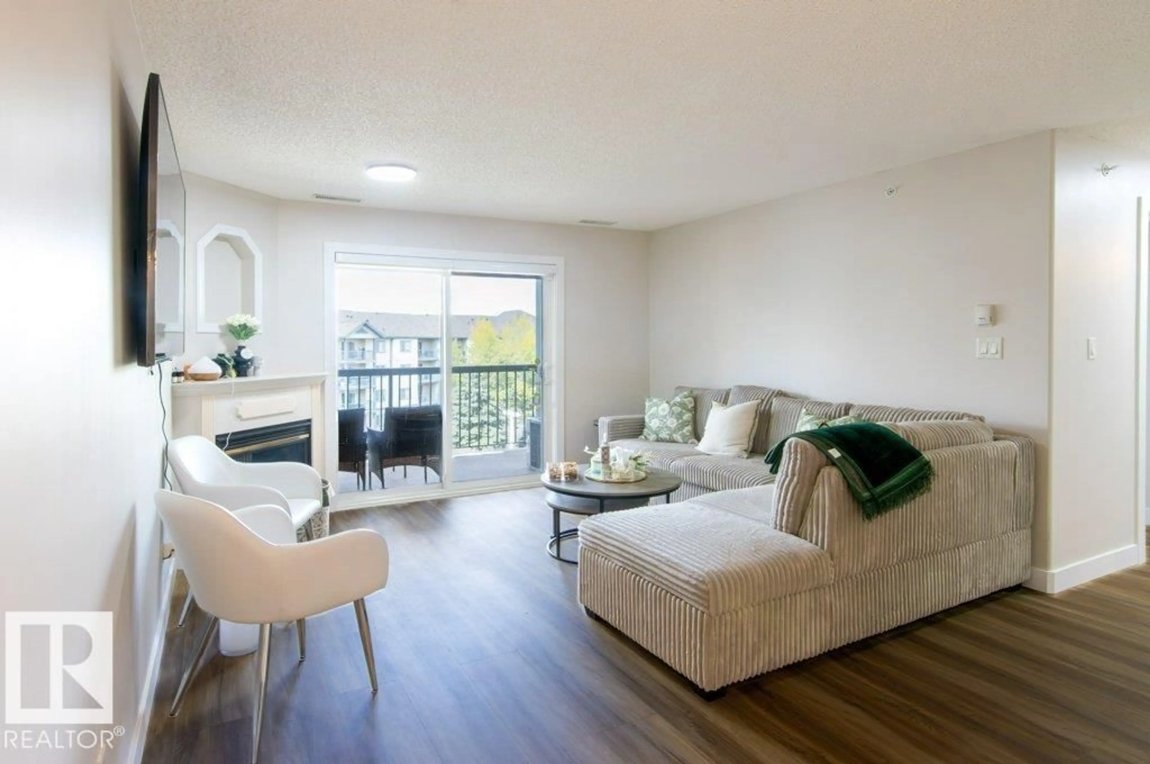 Living room with furniture, wood/laminate floor for #417 - 16303 95 ST, Edmonton Alberta T5Z3V1