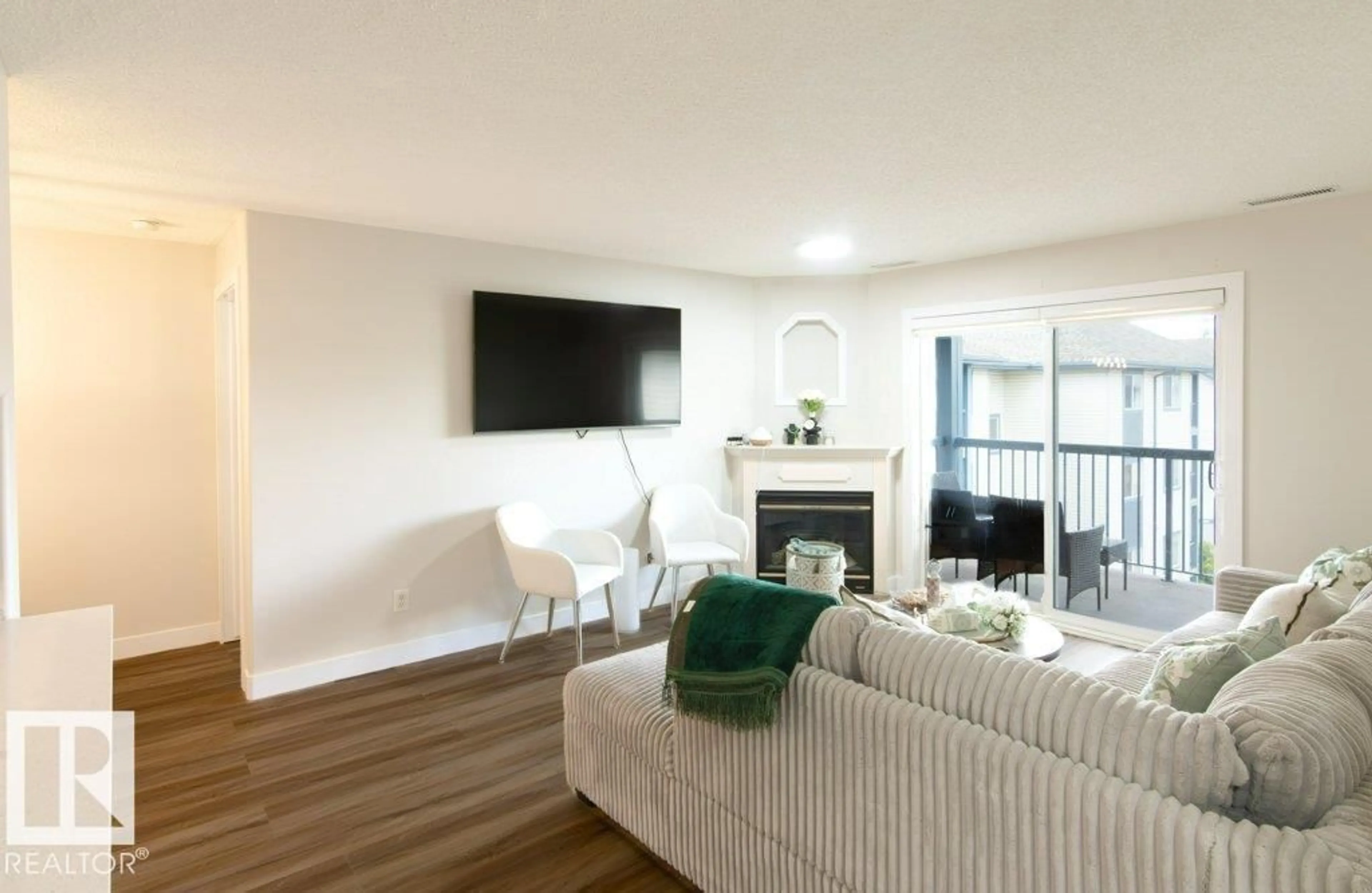 Living room with furniture, wood/laminate floor for #417 - 16303 95 ST, Edmonton Alberta T5Z3V1