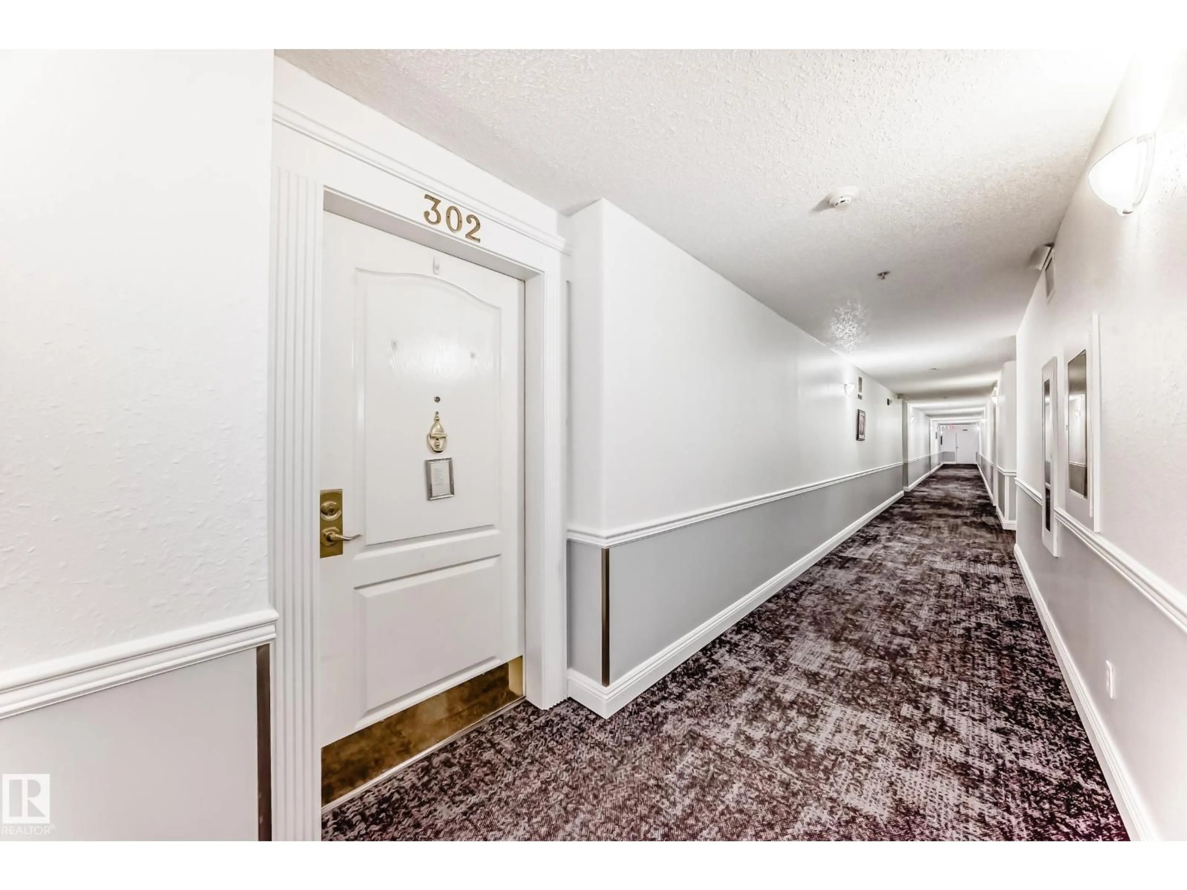 Indoor foyer for #302 - 13450 114 AV, Edmonton Alberta T5M4C4