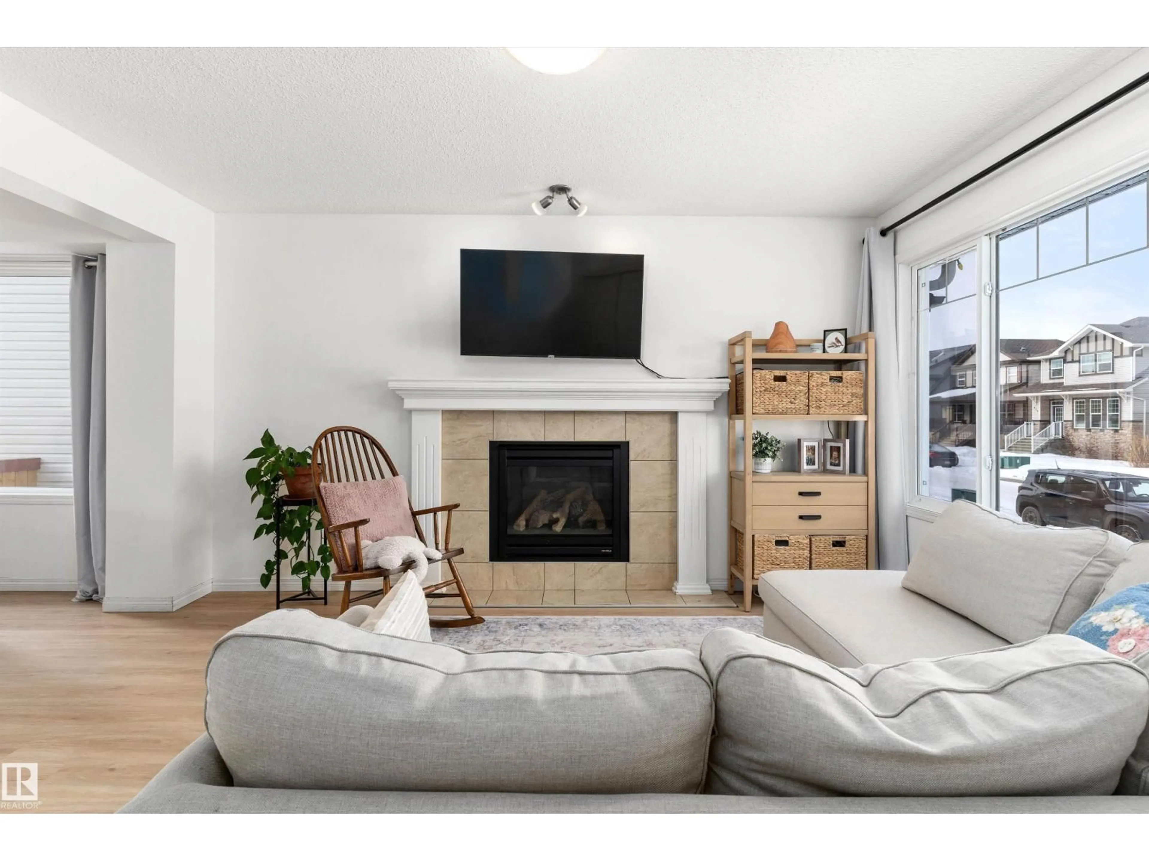 Living room with furniture, wood/laminate floor for 419 SONGHURST PL, Leduc Alberta T9E0P7