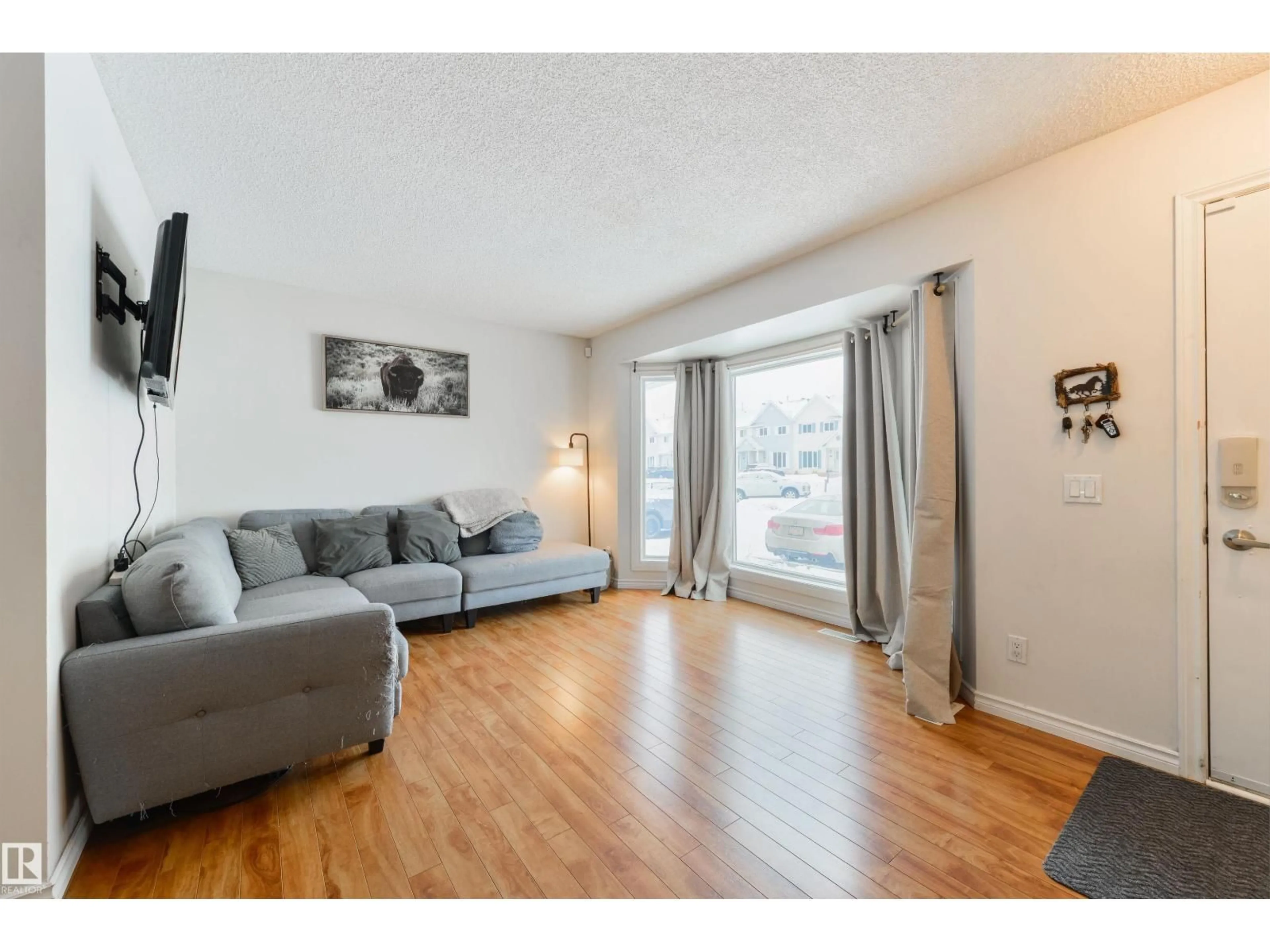 Living room with furniture, wood/laminate floor for 5 - 123 ABERDEEN WY, Stony Plain Alberta T7Z1N1