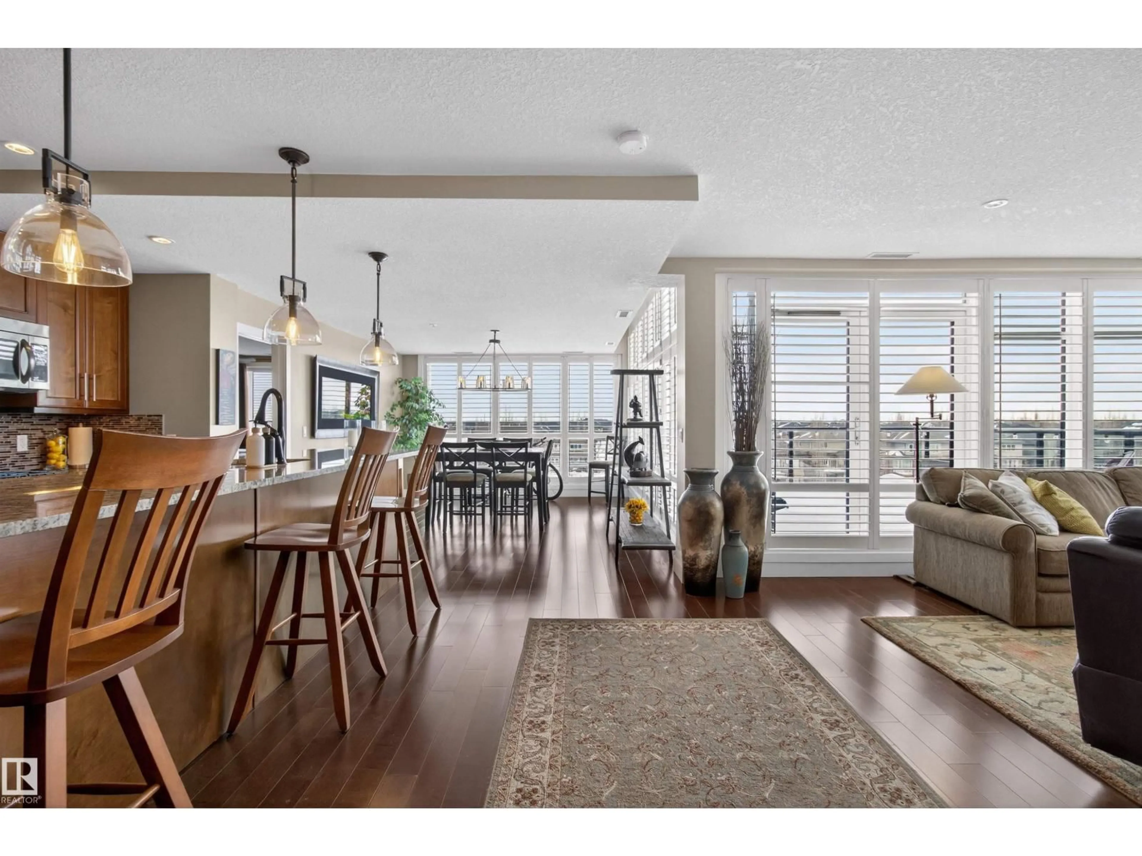 Open concept kitchen, wood/laminate floor for #405 - 1350 WINDERMERE WY, Edmonton Alberta T6W2J3