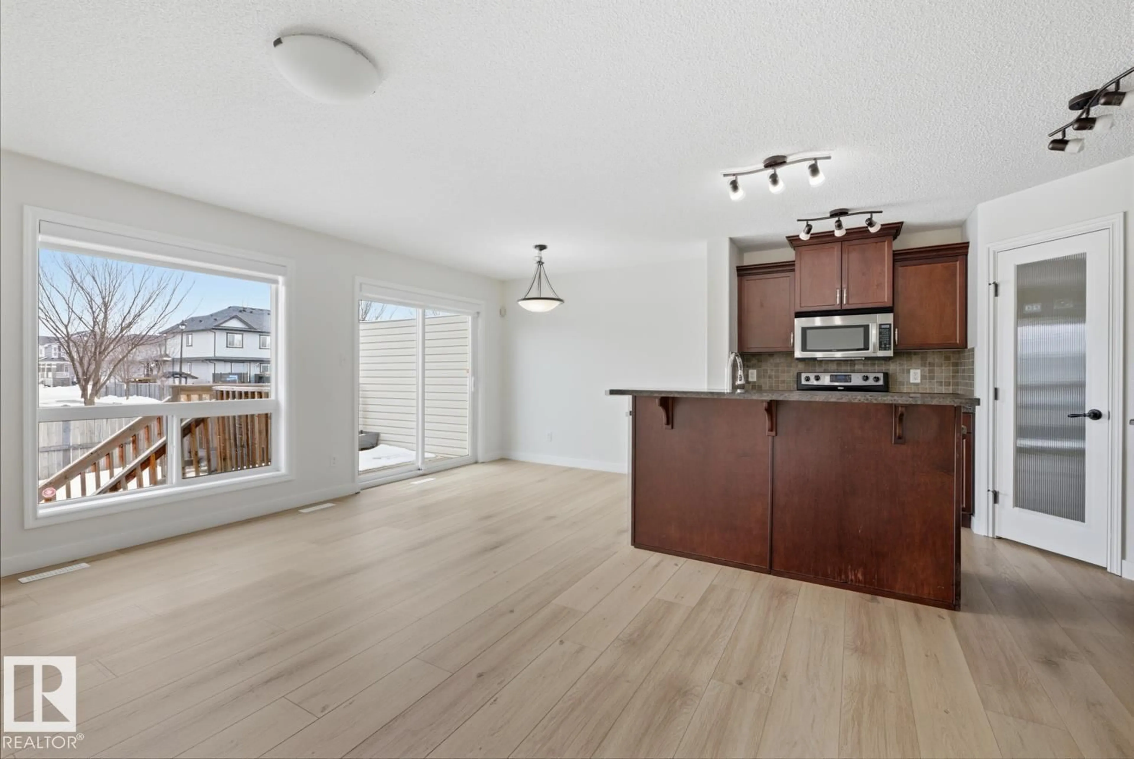 Open concept kitchen, wood/laminate floor for 73 KEYSTONE CRESCENT, Leduc Alberta T9E0M5