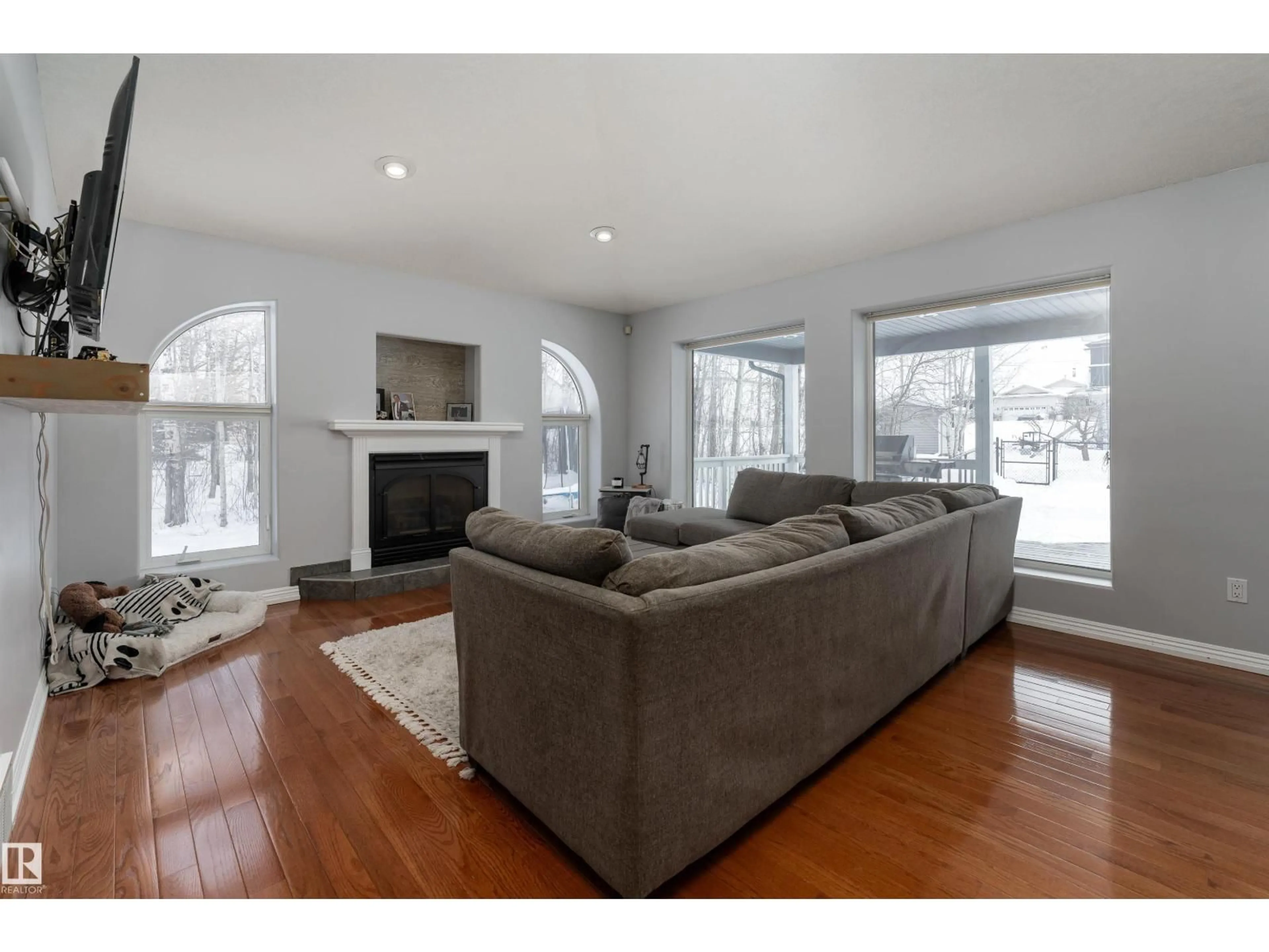 Living room with furniture, wood/laminate floor for 21 POWER DR, Rural Lac Ste. Anne County Alberta T0E0A0