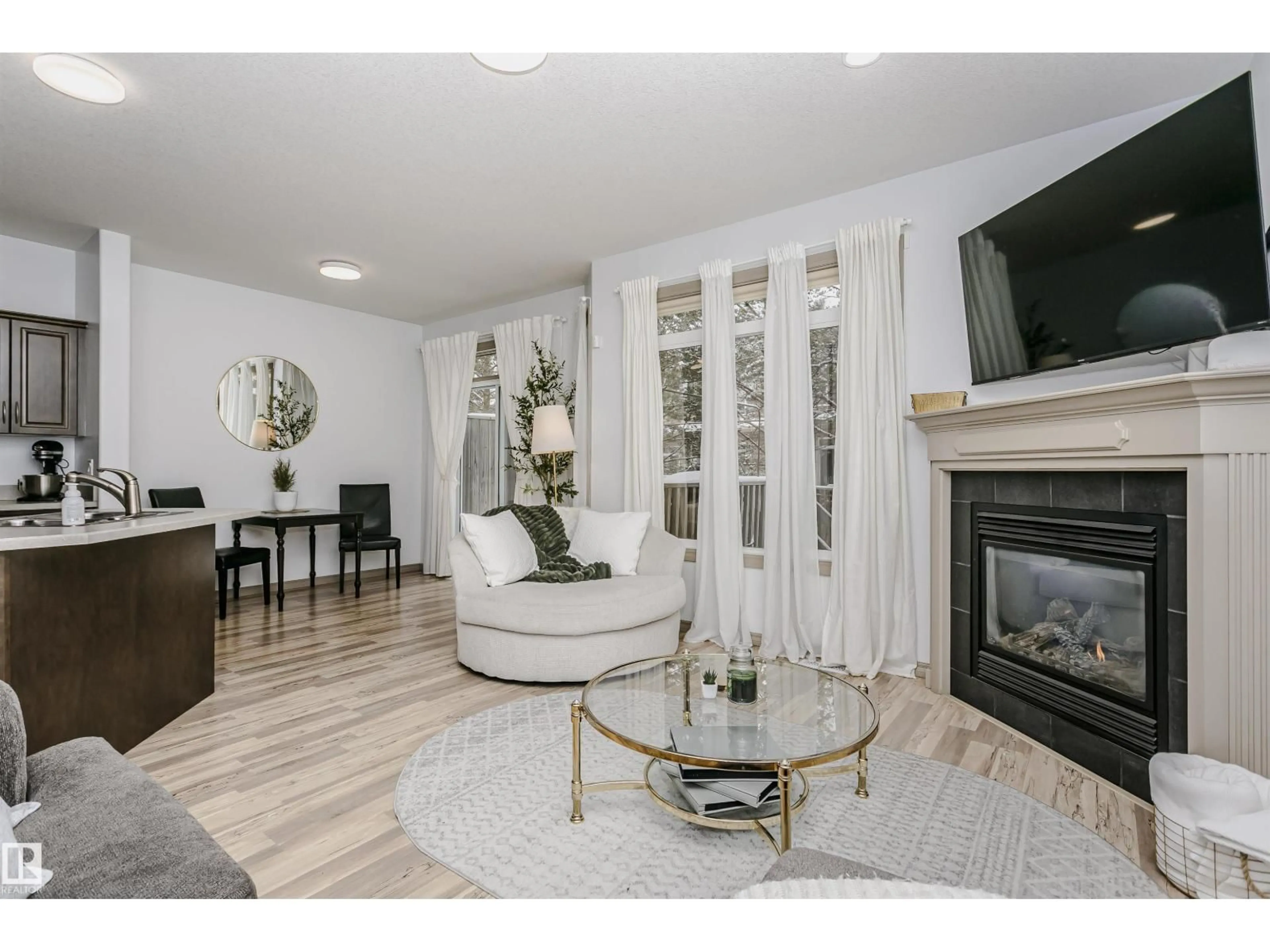 Living room with furniture, wood/laminate floor for 214 41 SUMMERWOOD BV, Sherwood Park Alberta T8H0C8