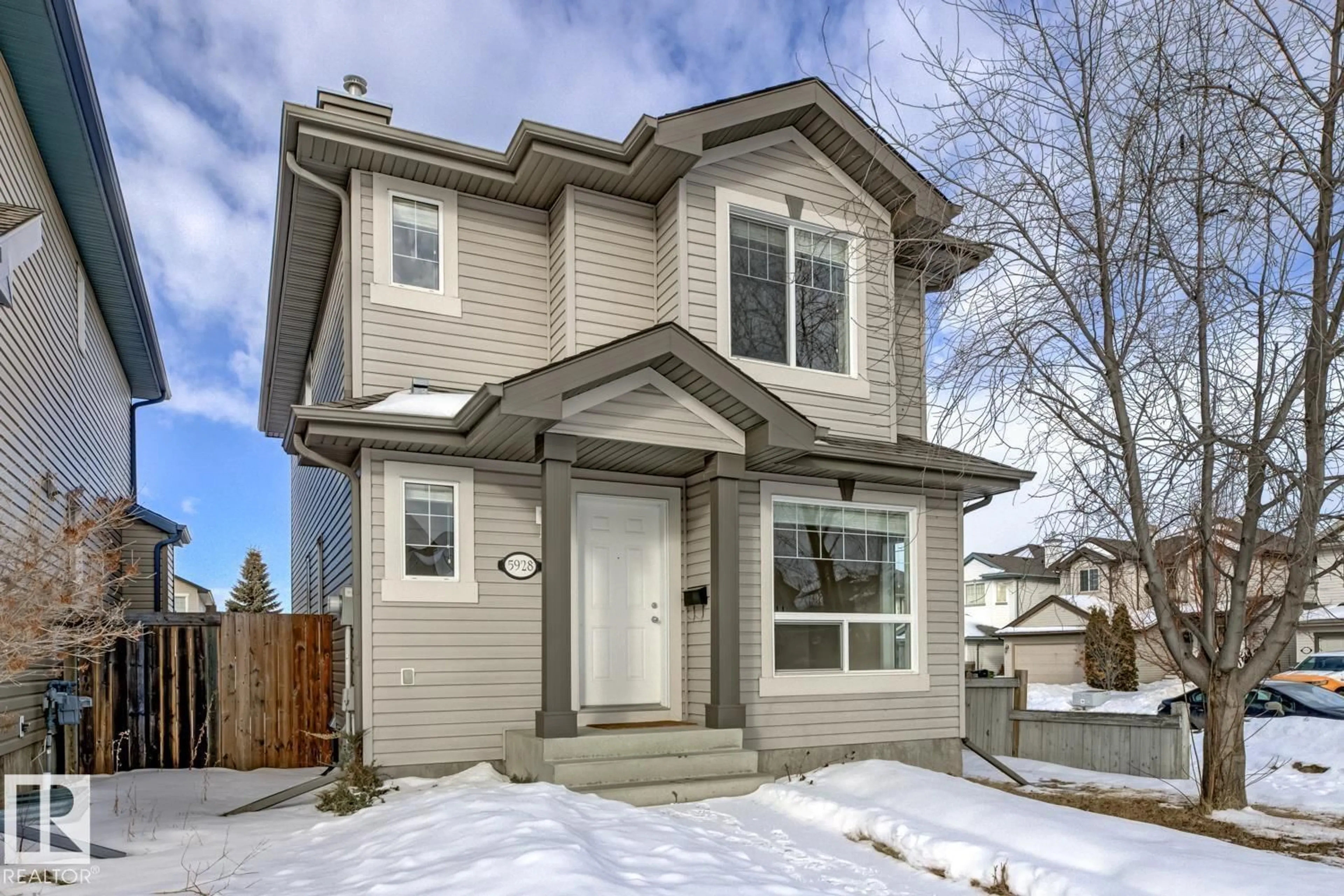 Home with vinyl exterior material, street for NW - 5928 203 ST, Edmonton Alberta T6M2Z3