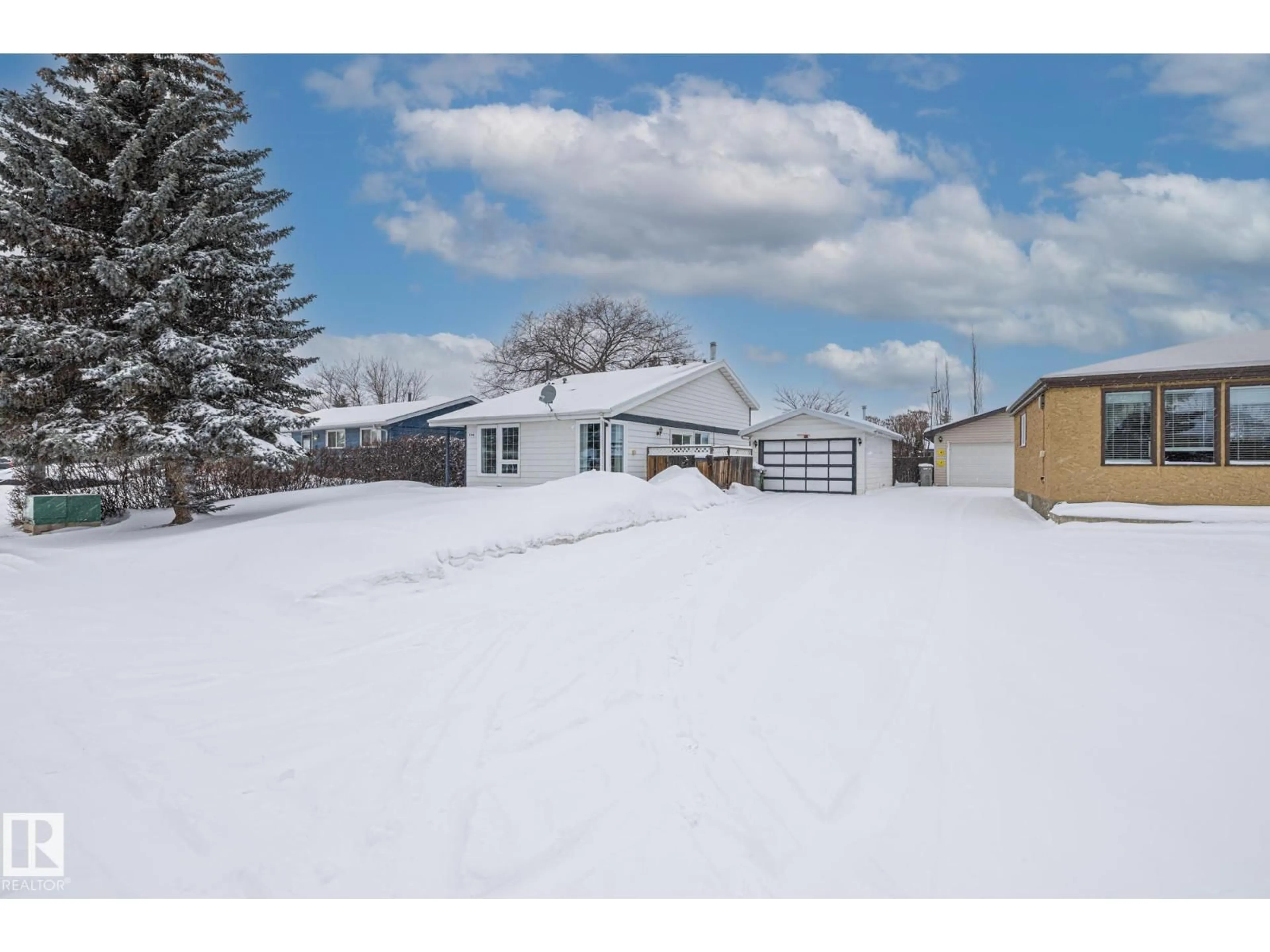 A pic from outside/outdoor area/front of a property/back of a property/a pic from drone, street for 9406 99 AV, Morinville Alberta T8R1K1