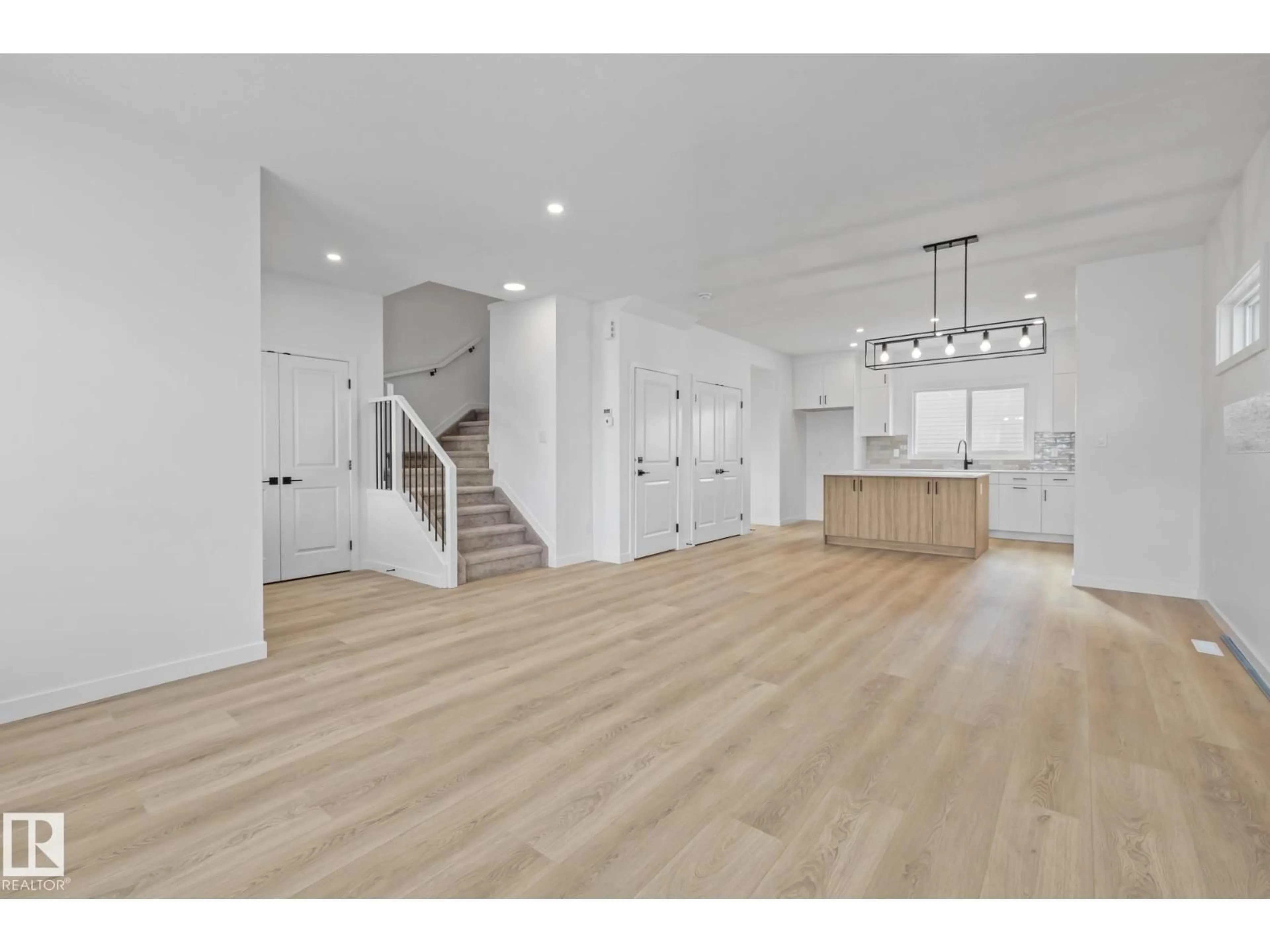 Open concept kitchen, wood/laminate floor for 54 EDEN LI, Fort Saskatchewan Alberta T8L0Z2