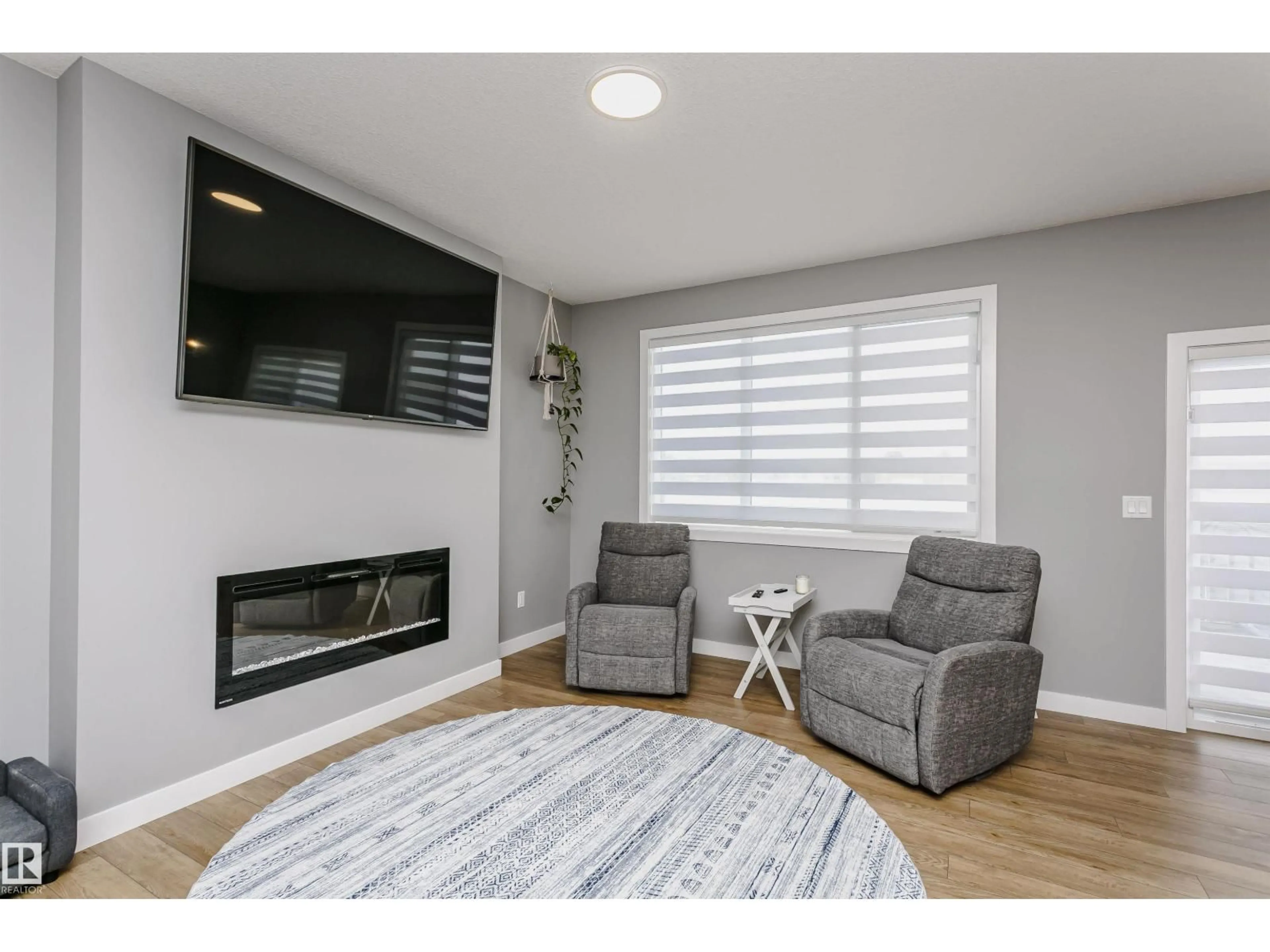 Living room with furniture, wood/laminate floor for 354 GENESIS, Stony Plain Alberta T7Z0J6