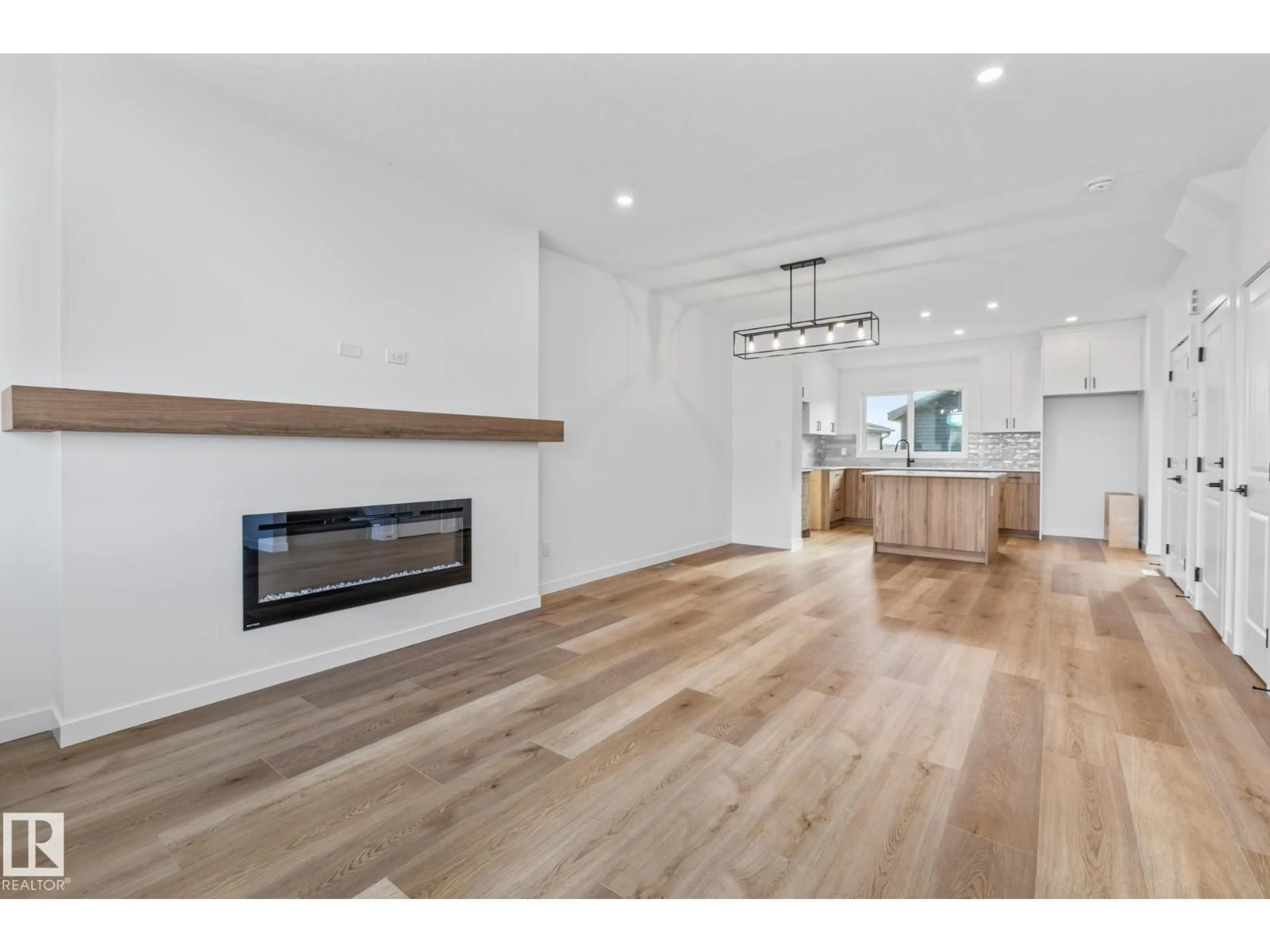 Open concept kitchen, wood/laminate floor for 70 EDEN LI, Fort Saskatchewan Alberta T8L0Z2