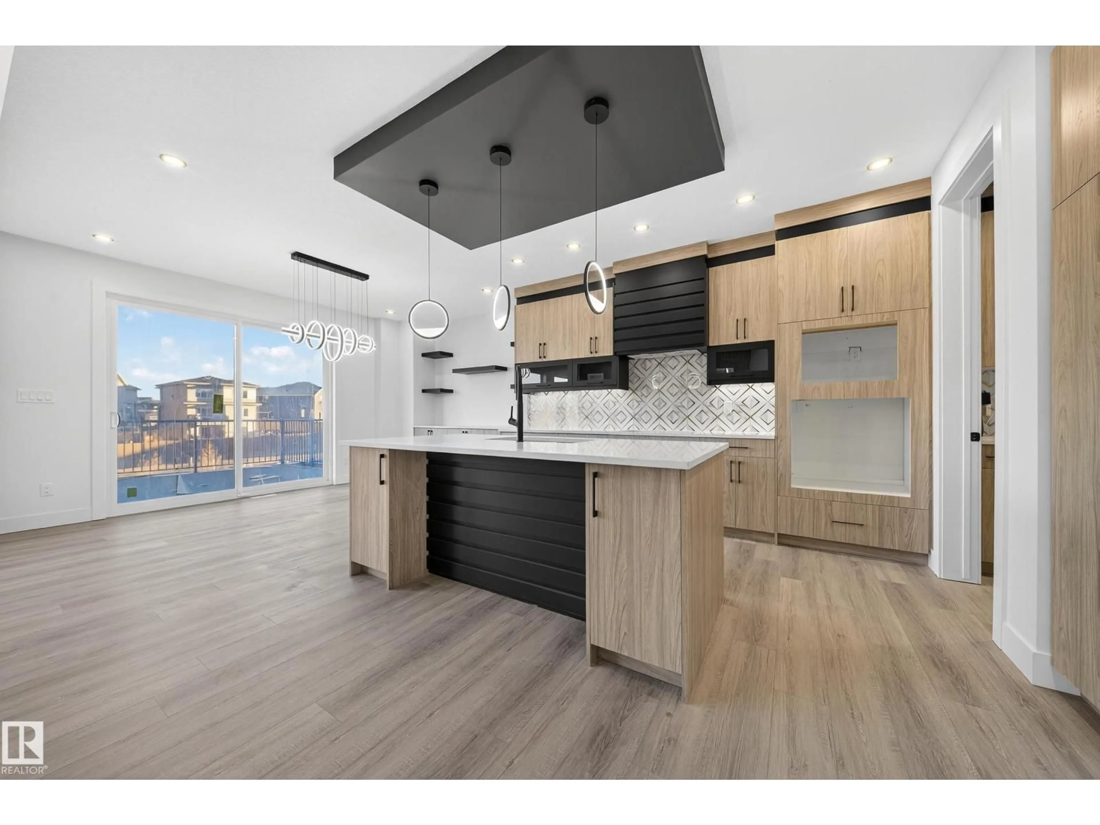 Open concept kitchen, wood/laminate floor for SW - 2010 COLLIP CR, Edmonton Alberta T6W5T4