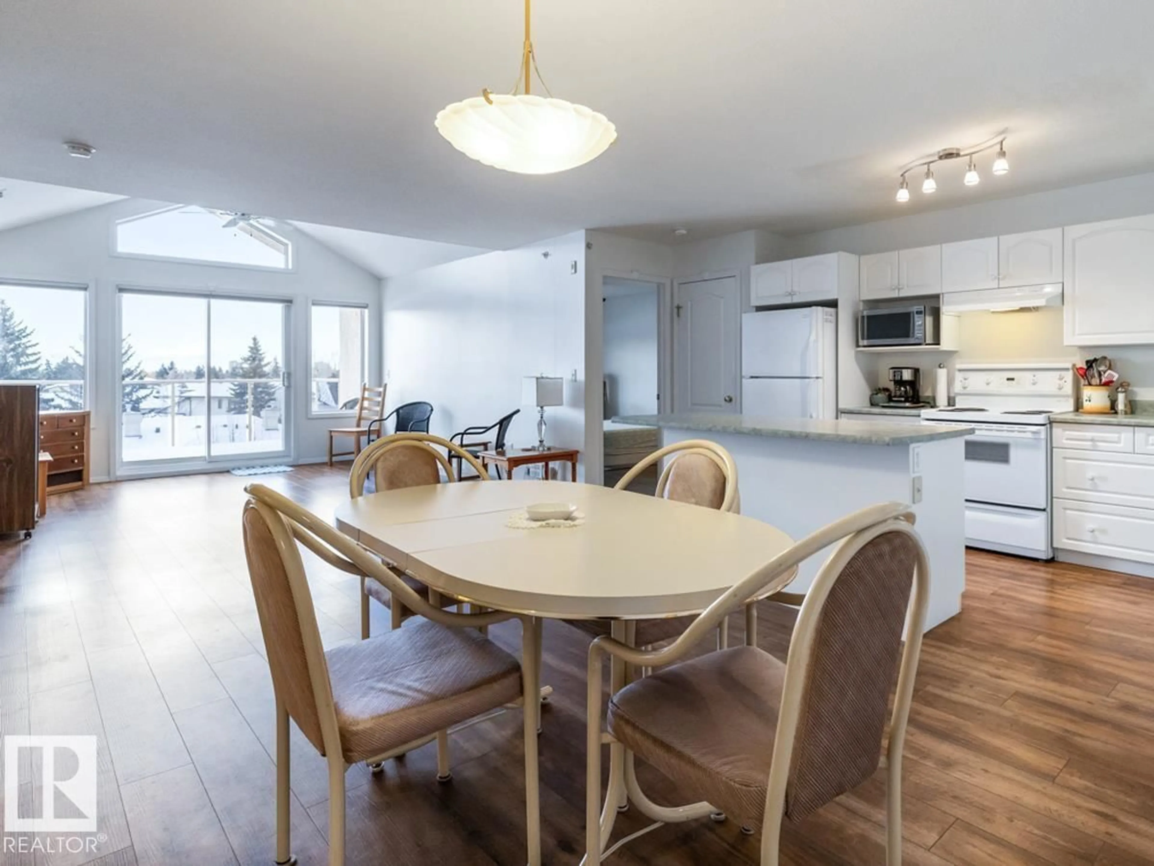 Open concept kitchen, wood/laminate floor for #312 - 10421 42 AV, Edmonton Alberta T6J7C8