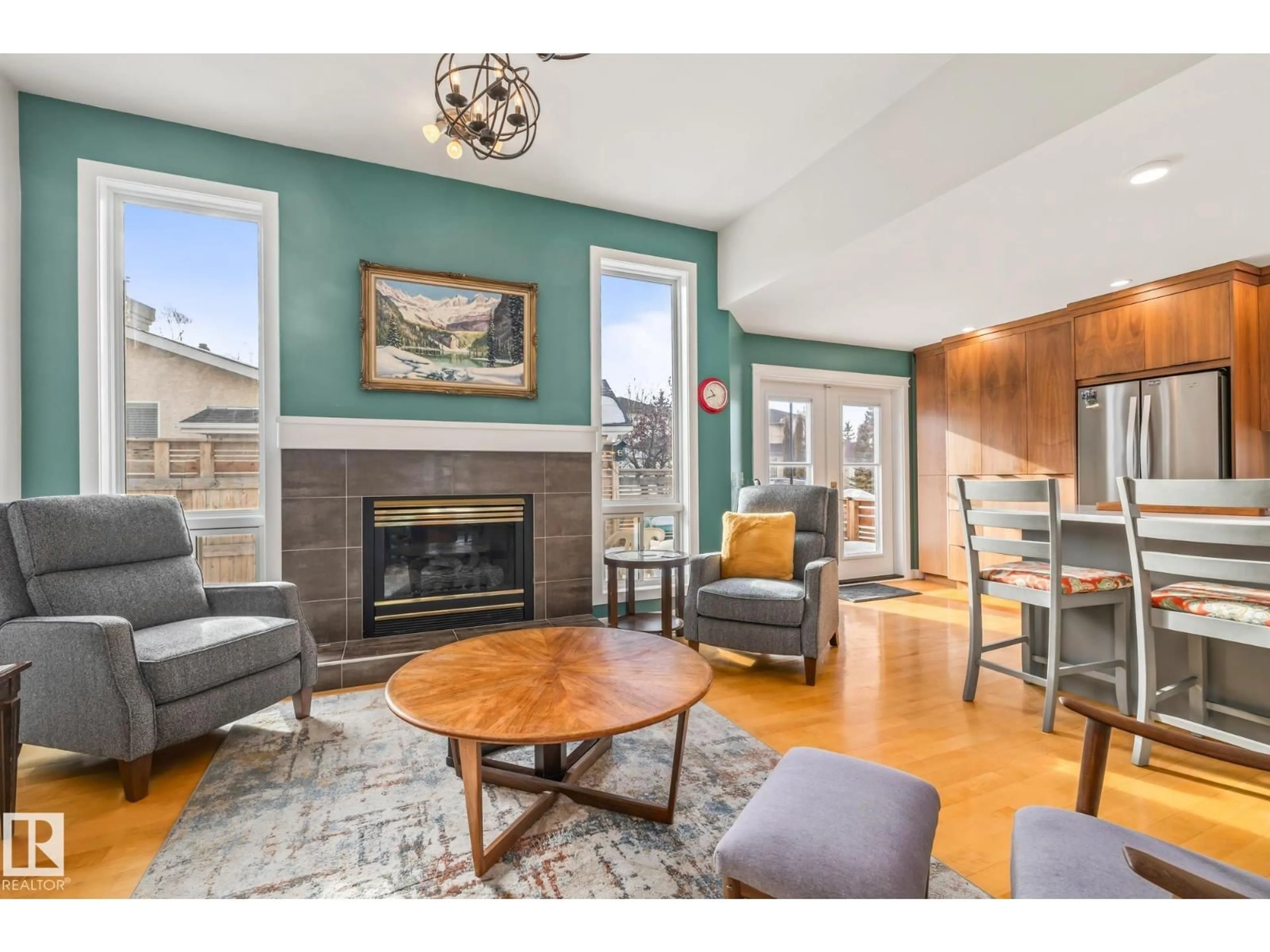 Living room with furniture, wood/laminate floor for 203 BANCROFT CL, Edmonton Alberta T5T6B5