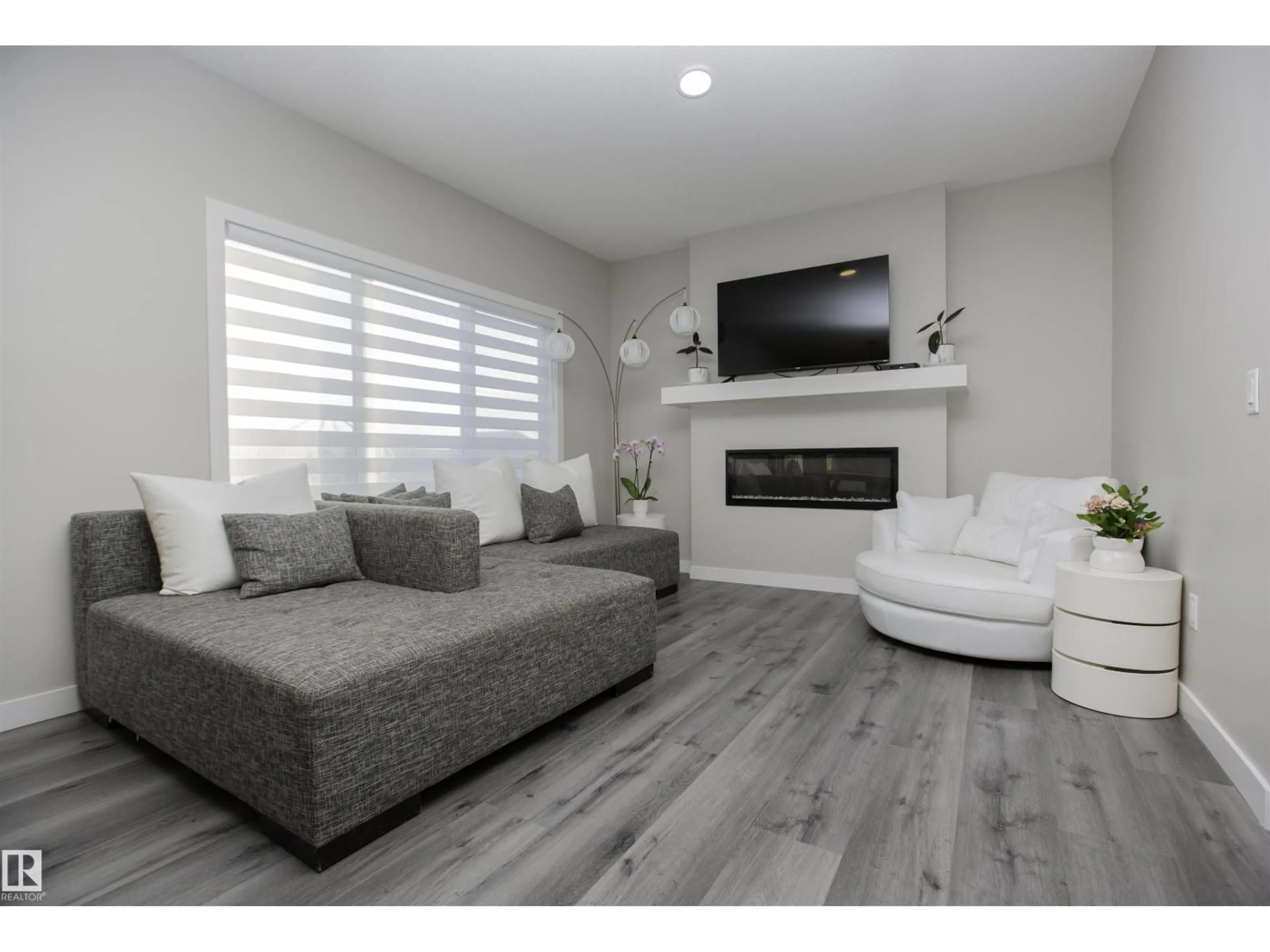 Living room with furniture, wood/laminate floor for 15 SPRINGBROOK WD, Spruce Grove Alberta T7X0E7