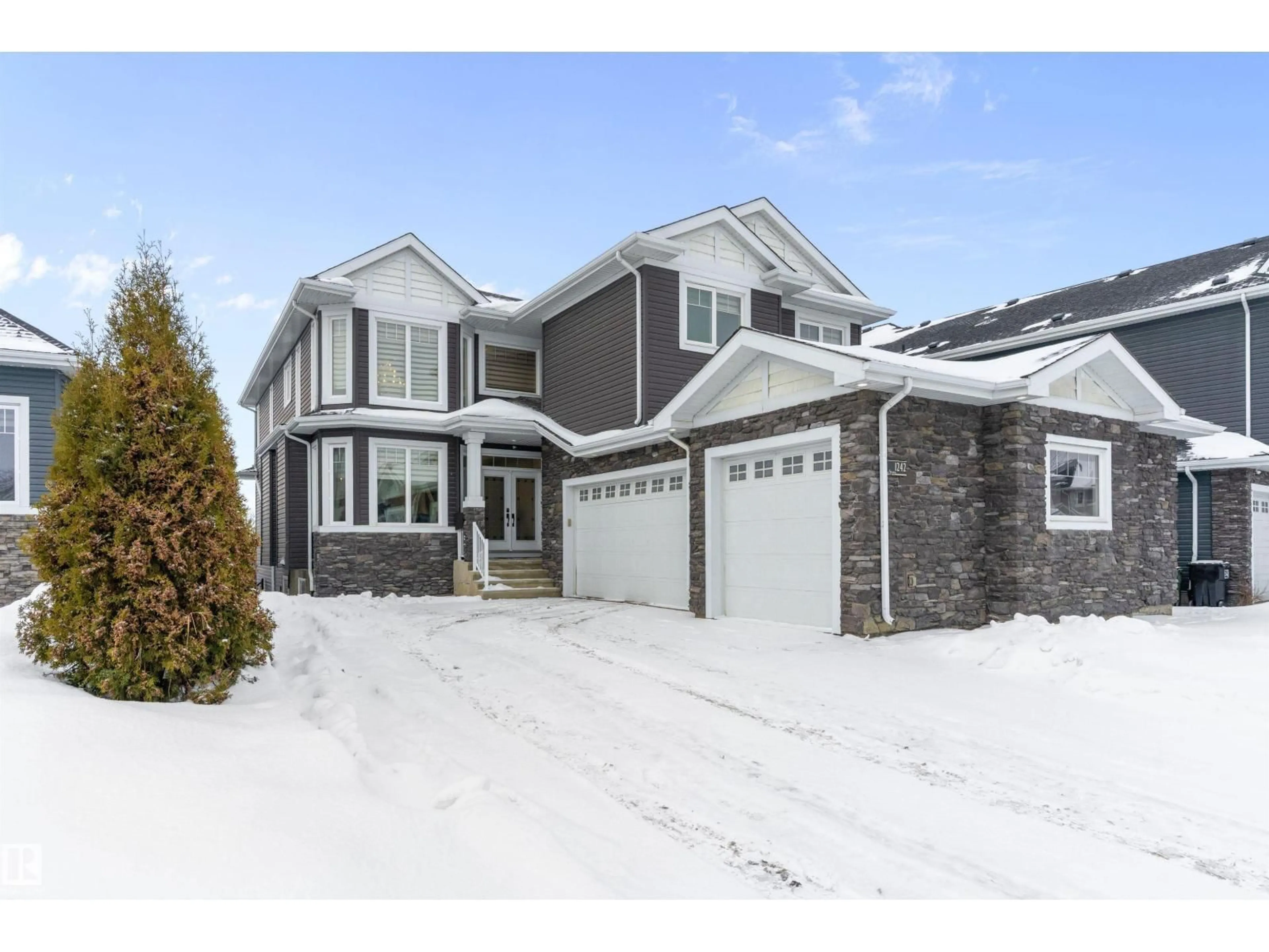 Home with vinyl exterior material, street for 1242 STARLING DR, Edmonton Alberta T5S0K4