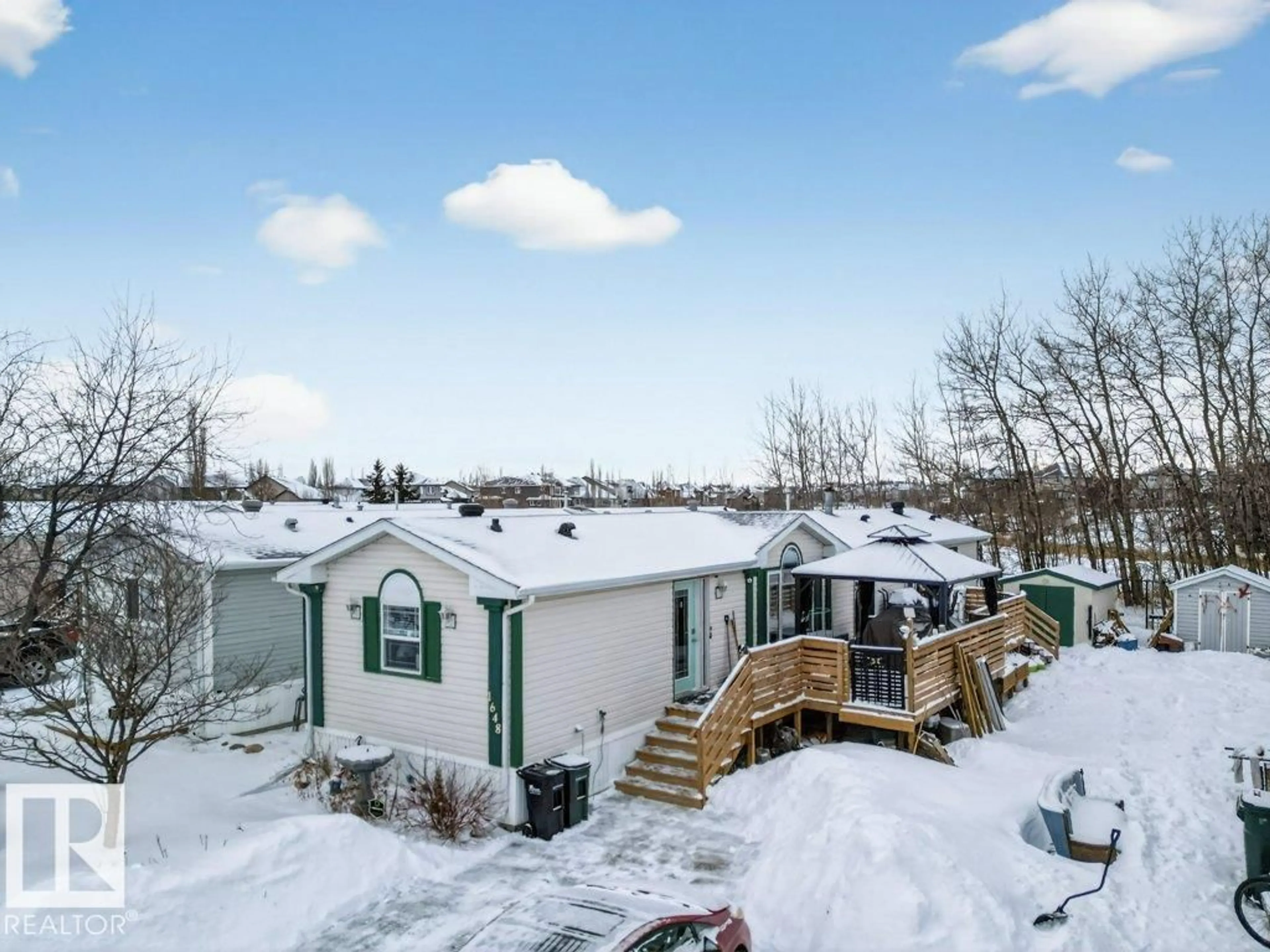A pic from outside/outdoor area/front of a property/back of a property/a pic from drone, mountain view for 1648 JUBILEE CR, Sherwood Park Alberta T8H2J4