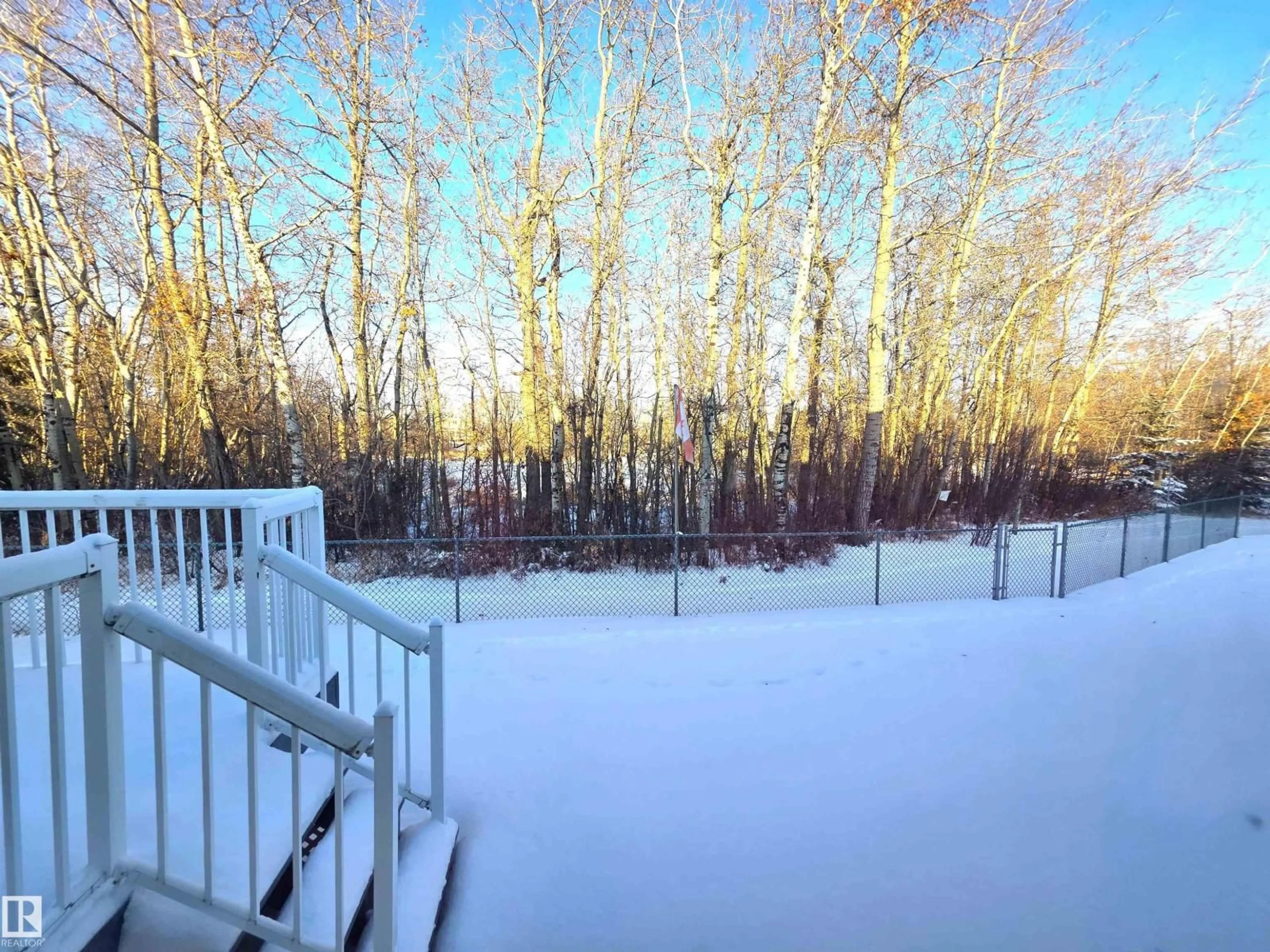 Patio, forest/trees view for 208 RAVINE VI, Leduc Alberta T9E8B9