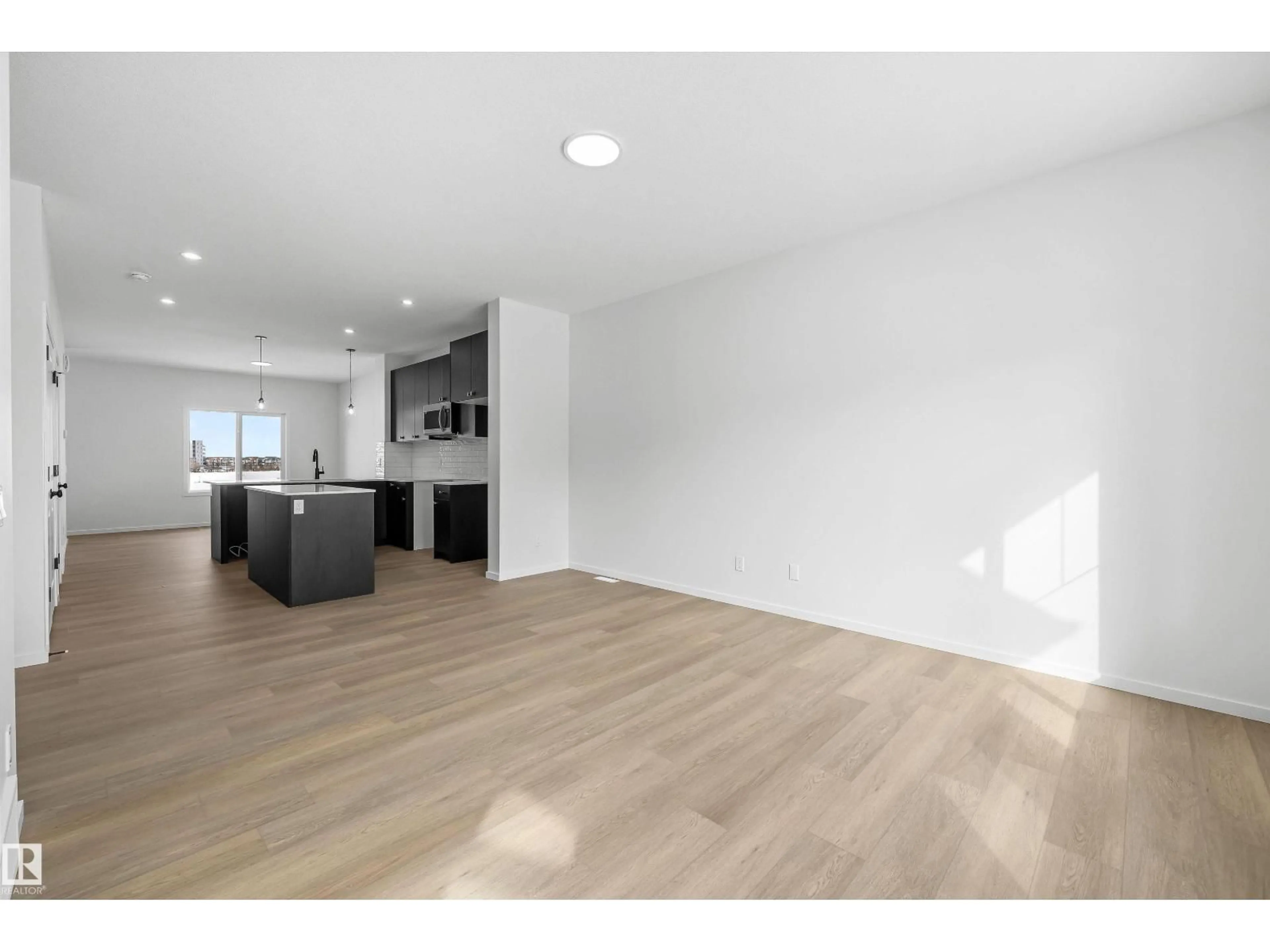 Open concept kitchen, wood/laminate floor for 276 CHAPPELLE DR, Edmonton Alberta T6W5R4