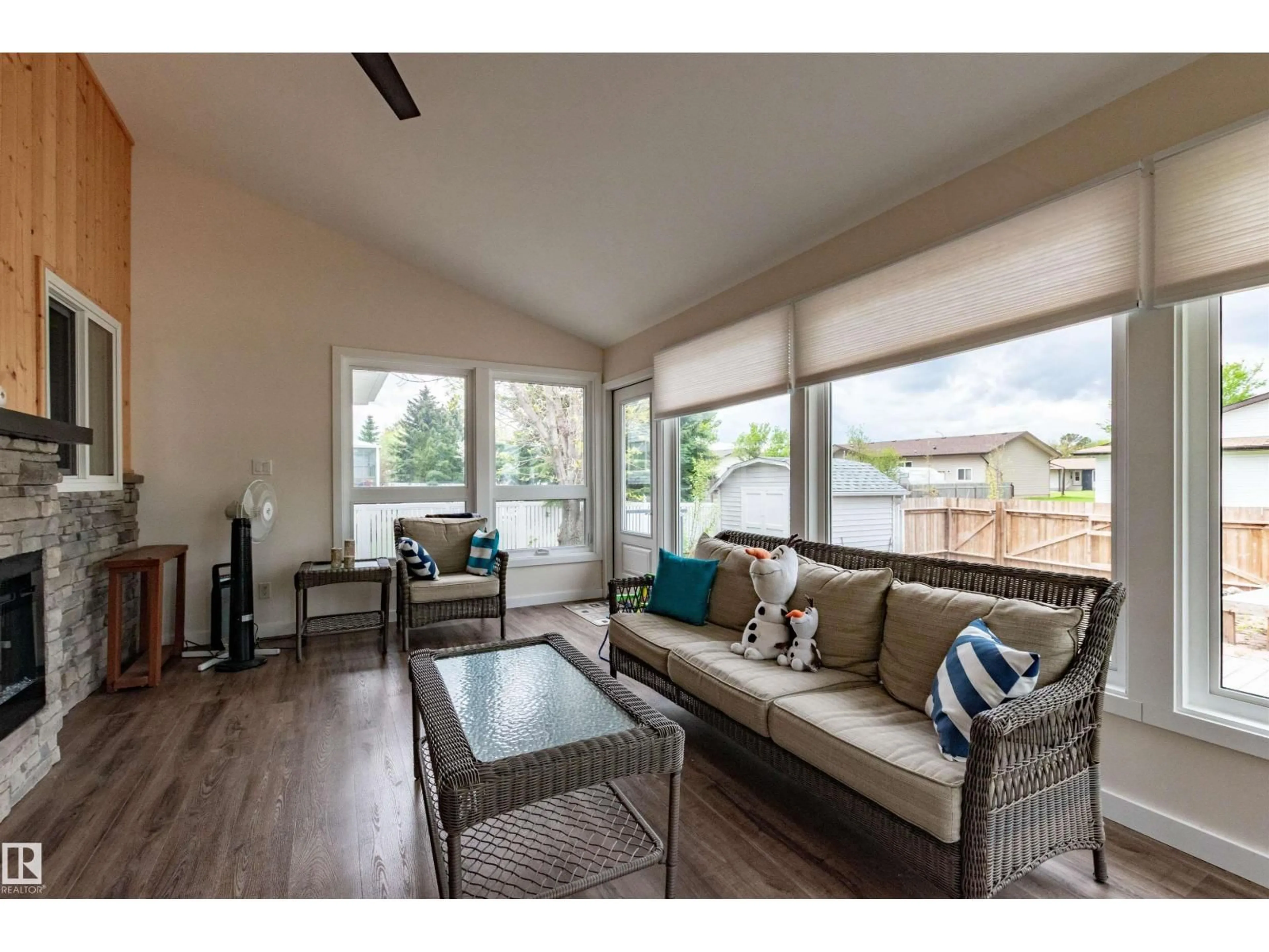 Living room with furniture, wood/laminate floor for 4126 46 ST, Vegreville Alberta T9C1C2