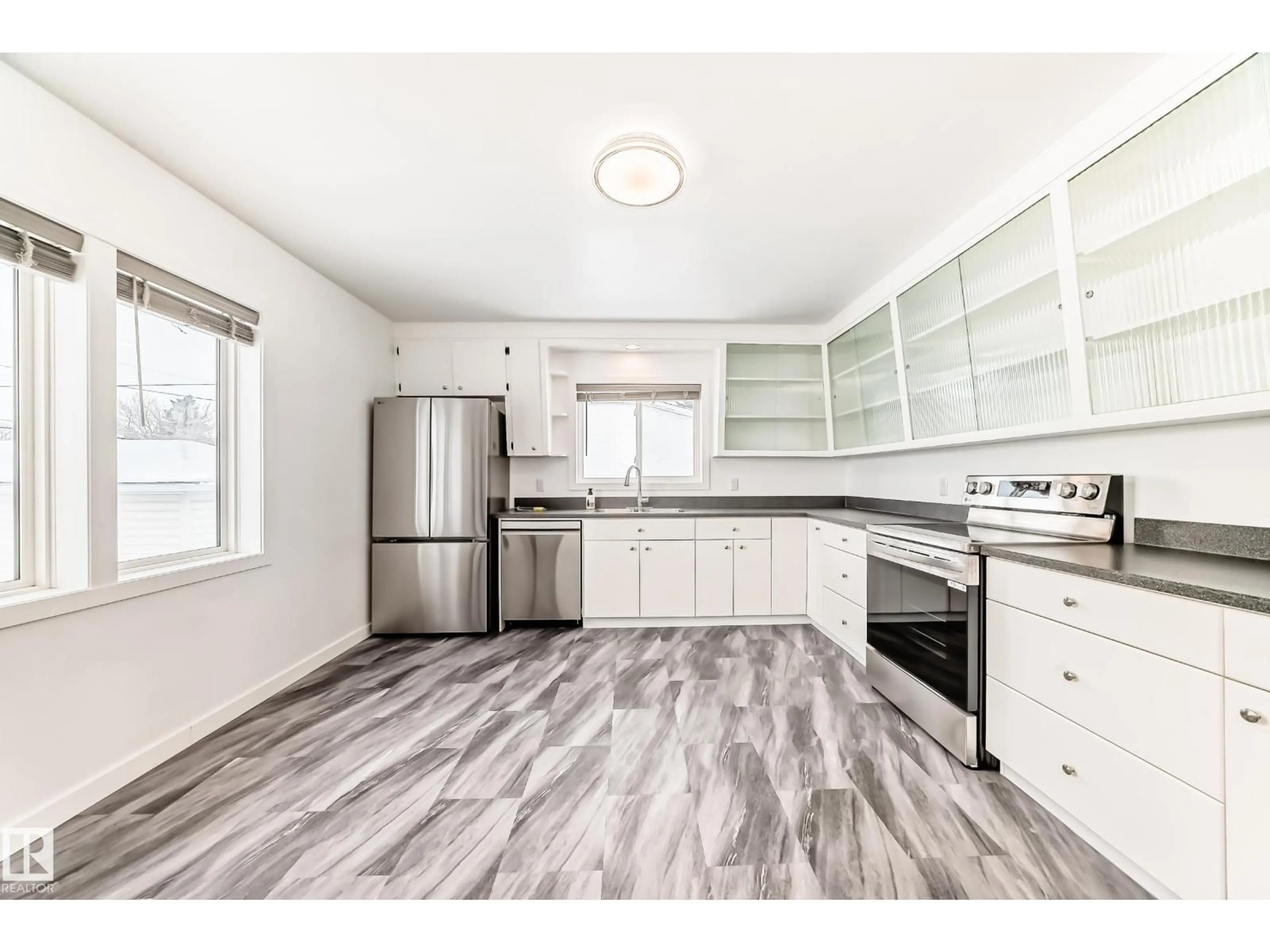 Open concept kitchen, wood/laminate floor for 5645 50 ST, Vegreville Alberta T9C1H7