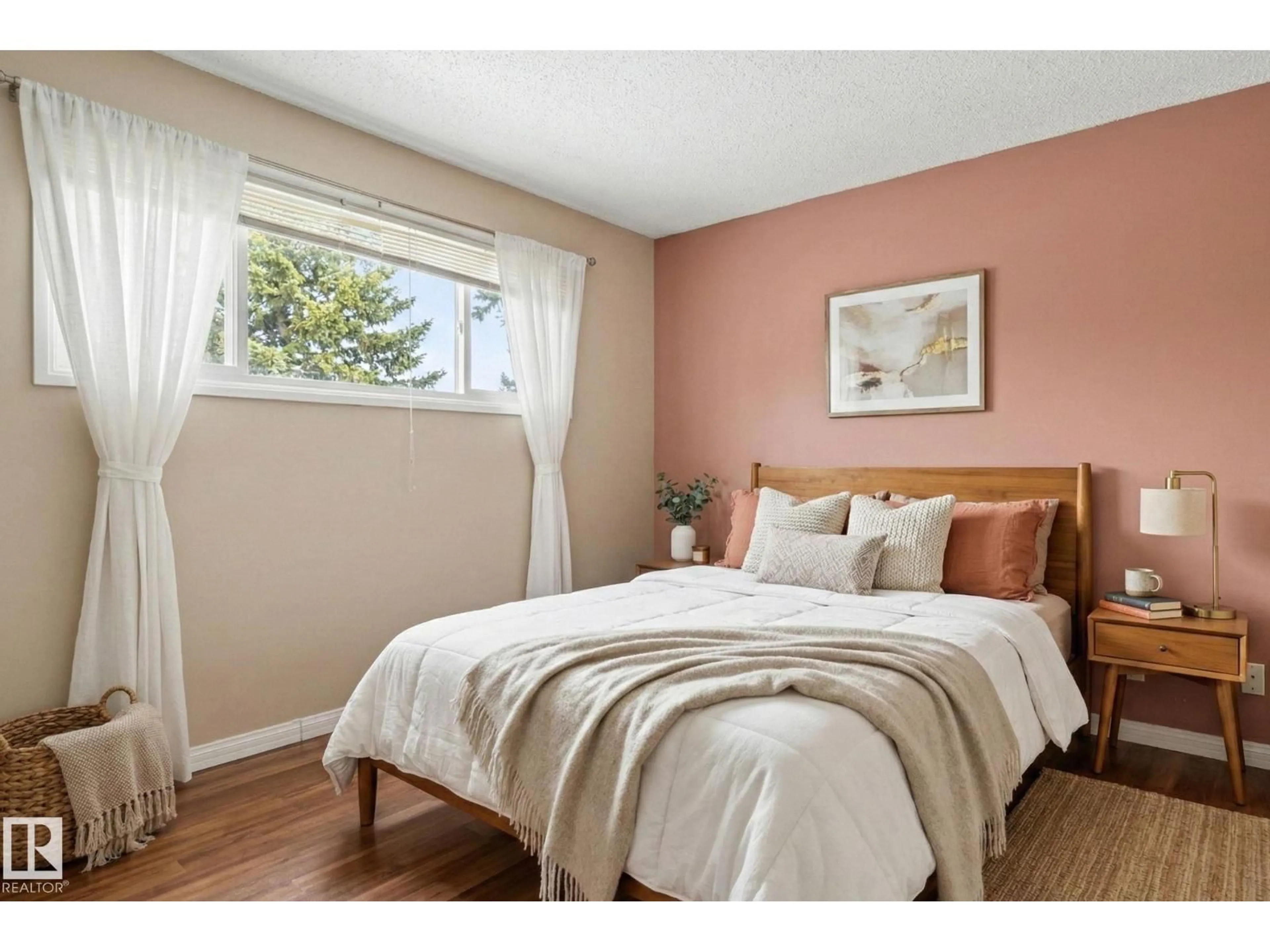 Bedroom with bed, wood/laminate floor for 8149 27 AV, Edmonton Alberta T6K2Y5