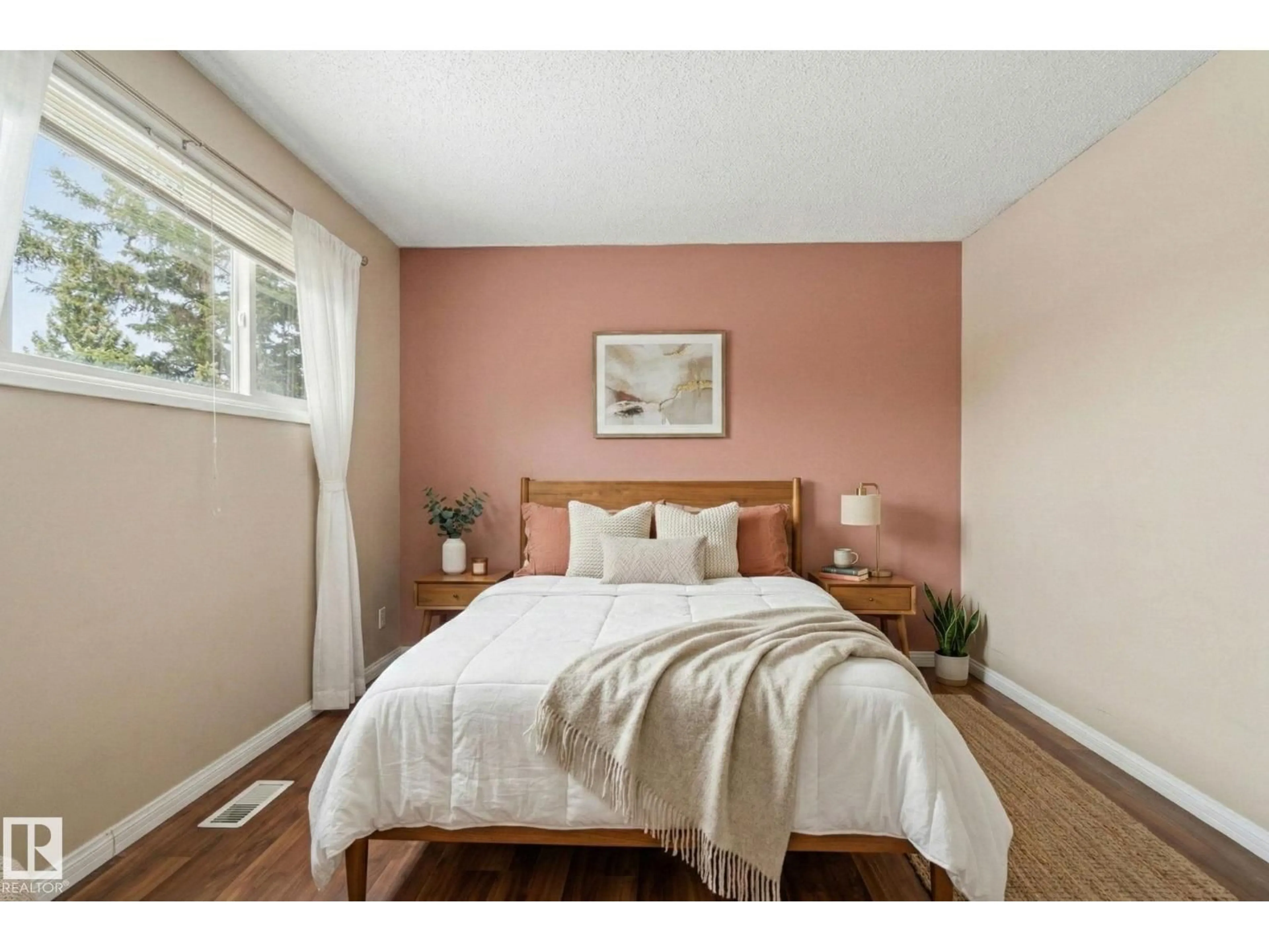 Bedroom with bed, wood/laminate floor for 8149 27 AV, Edmonton Alberta T6K2Y5