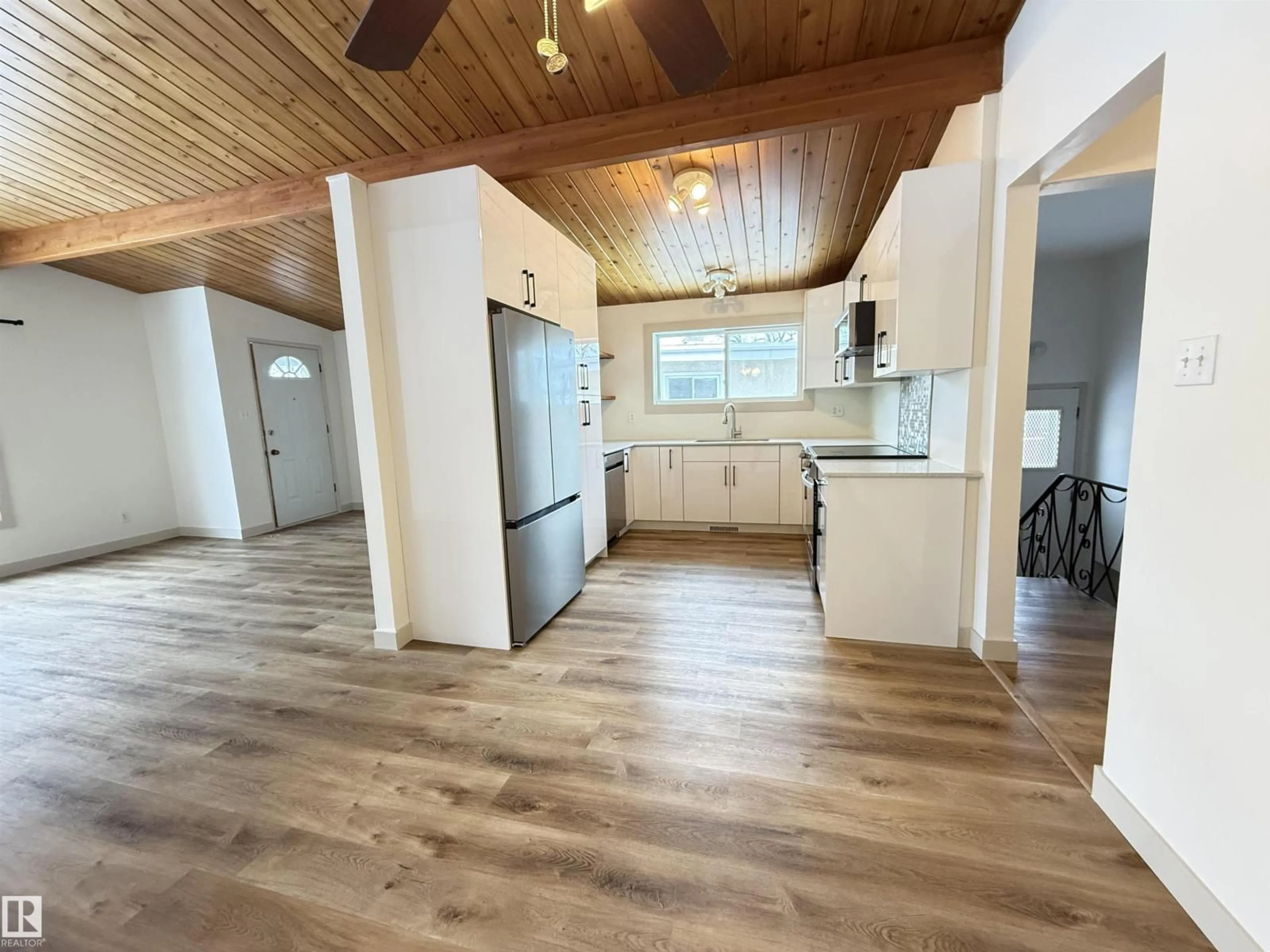 Open concept kitchen, wood/laminate floor for NW - 9034 60 ST, Edmonton Alberta T6B1M8