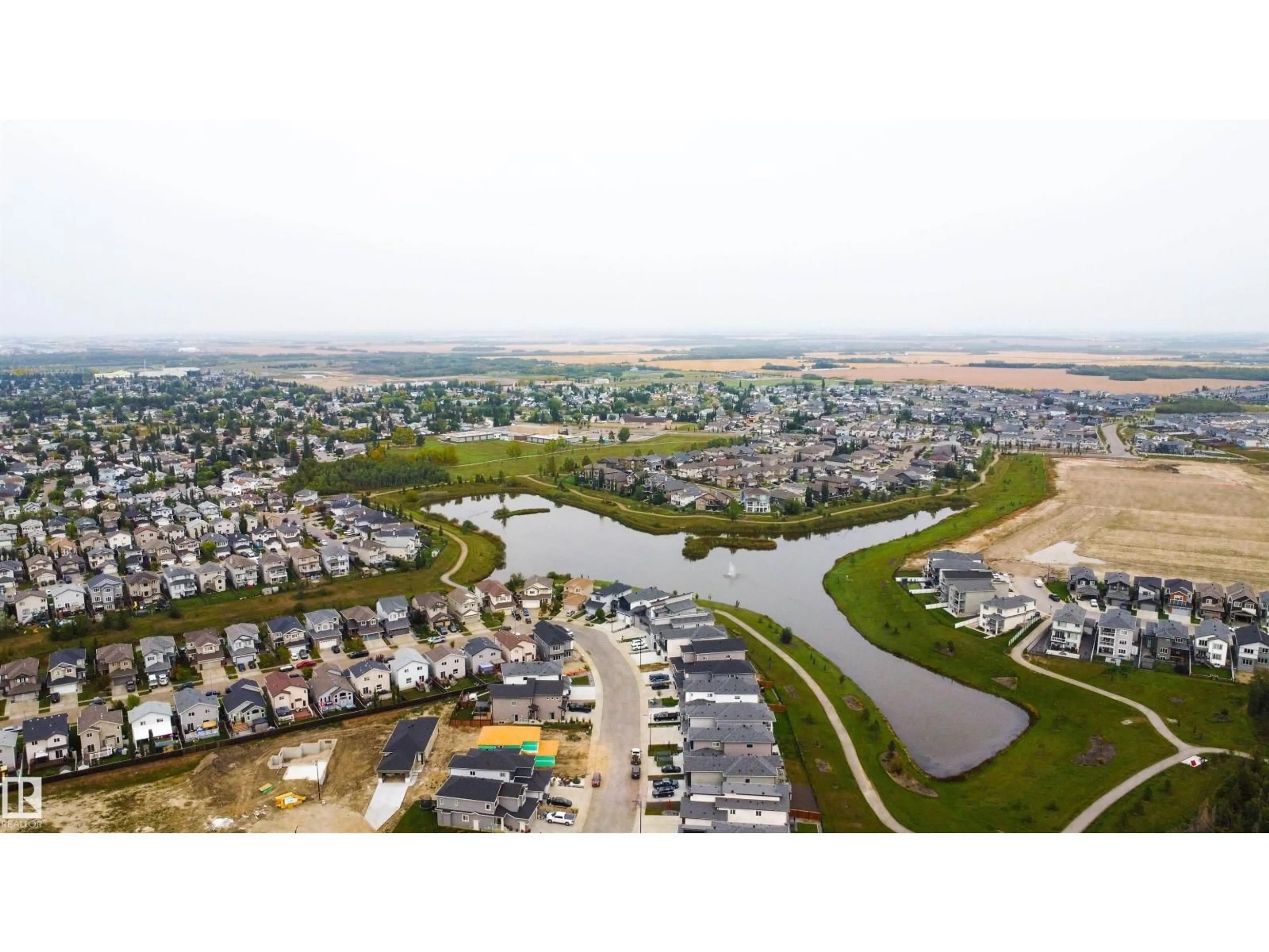 A pic from outside/outdoor area/front of a property/back of a property/a pic from drone, water/lake/river/ocean view for 182 CALEDONIA DR, Leduc Alberta T9E0J9