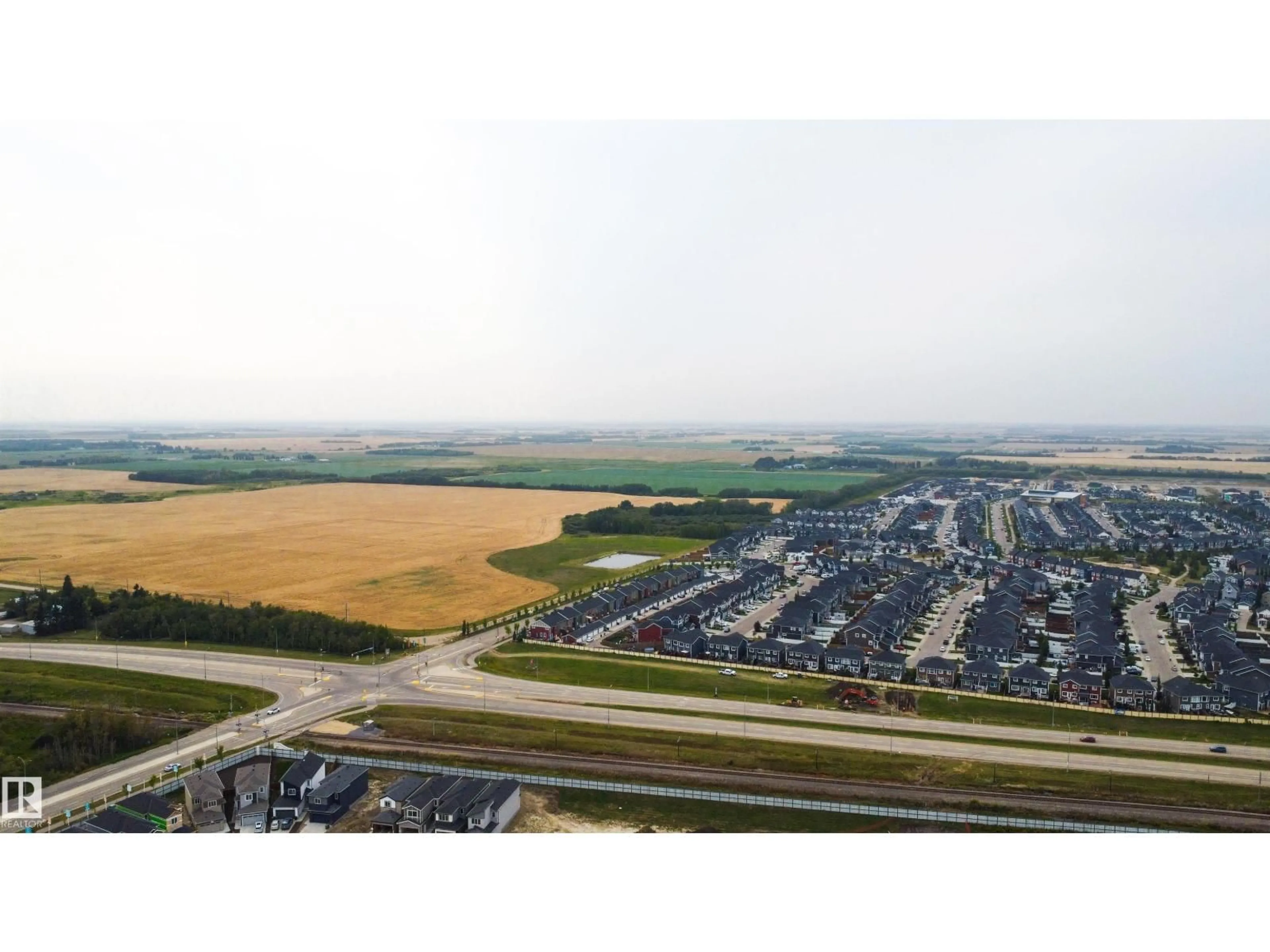 A pic from outside/outdoor area/front of a property/back of a property/a pic from drone, mountain view for 182 CALEDONIA DR, Leduc Alberta T9E0J9