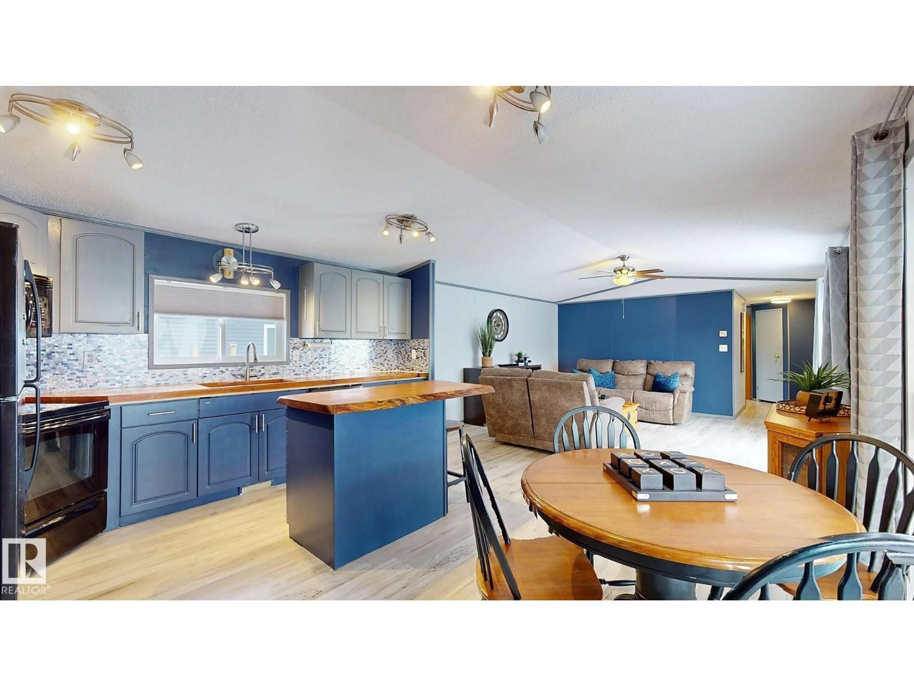 Open concept kitchen, wood/laminate floor for 9 SUNSET BV, Spruce Grove Alberta T7X3J1