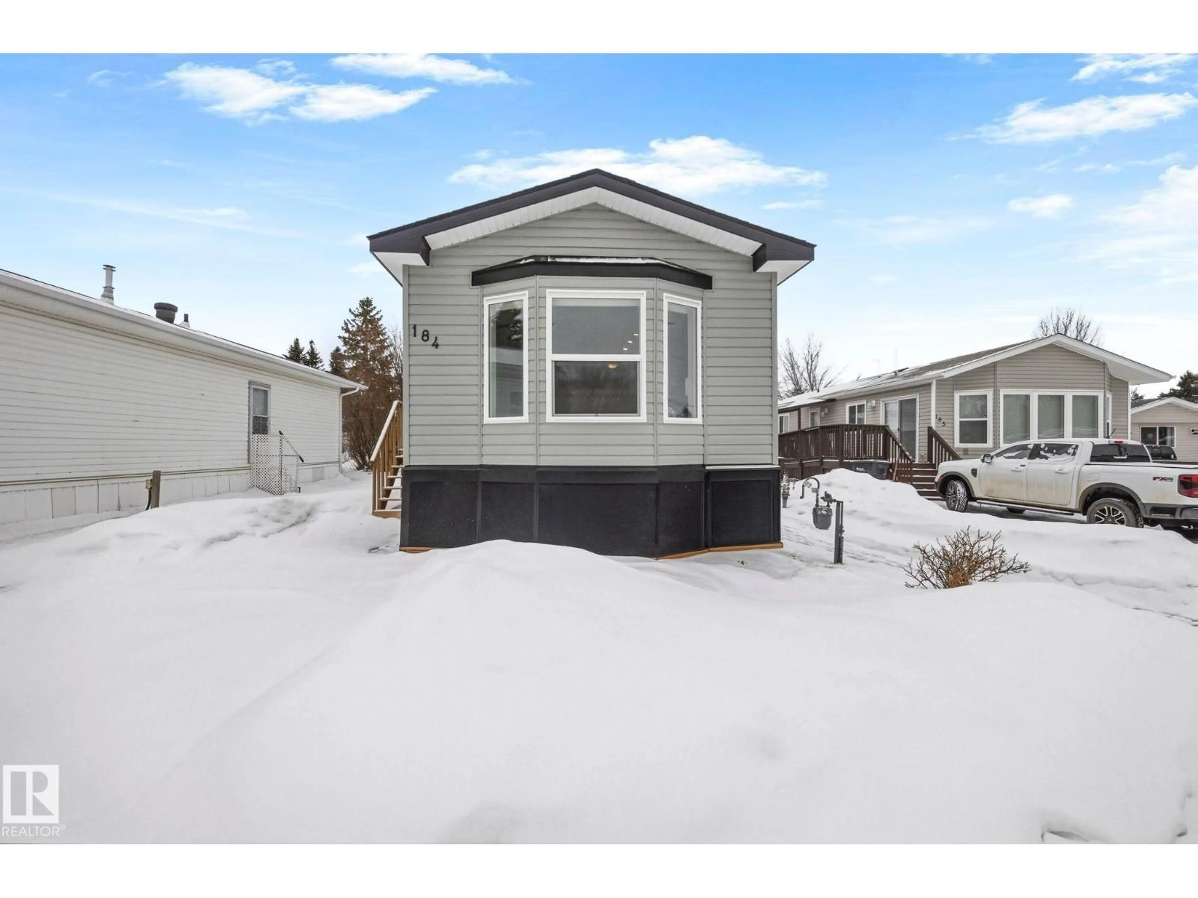 Home with vinyl exterior material, street for 305 - 184 CALAHOO RD, Spruce Grove Alberta T7X3L1