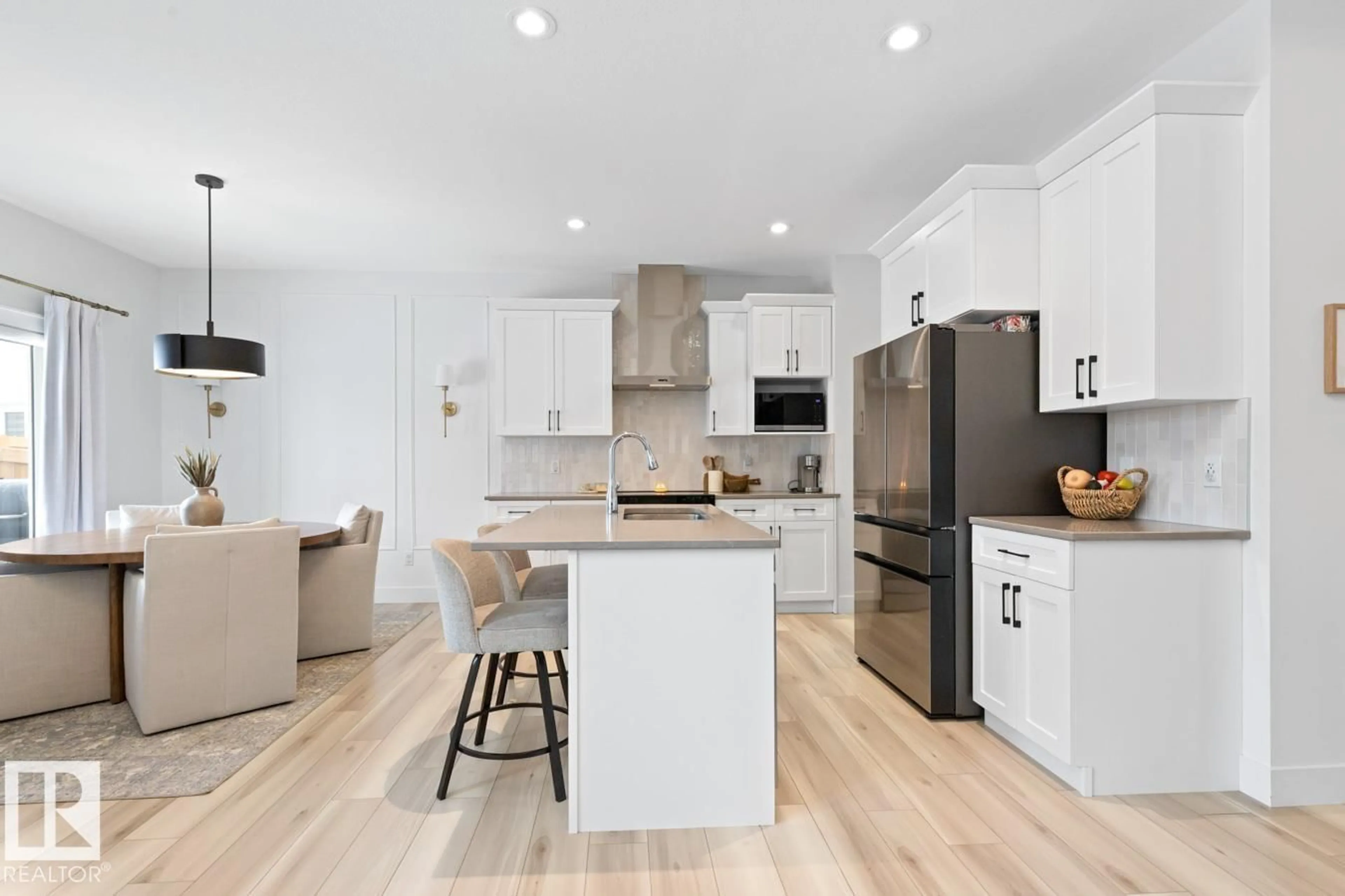 Open concept kitchen, wood/laminate floor for 3808 42 AV, Beaumont Alberta T4X2Z6