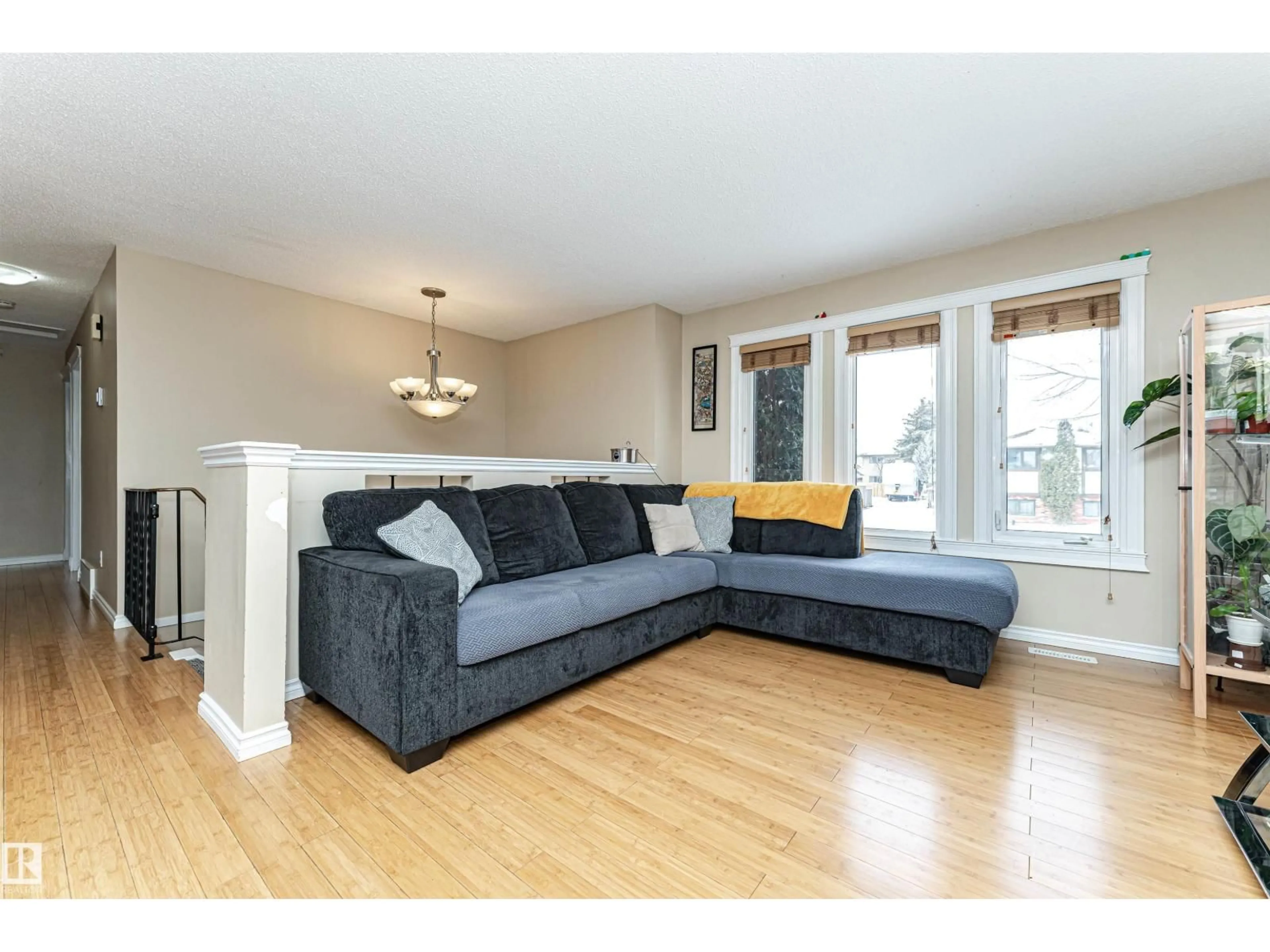 Living room with furniture, wood/laminate floor for NW - 16331 119 ST, Edmonton Alberta T5X4Z3
