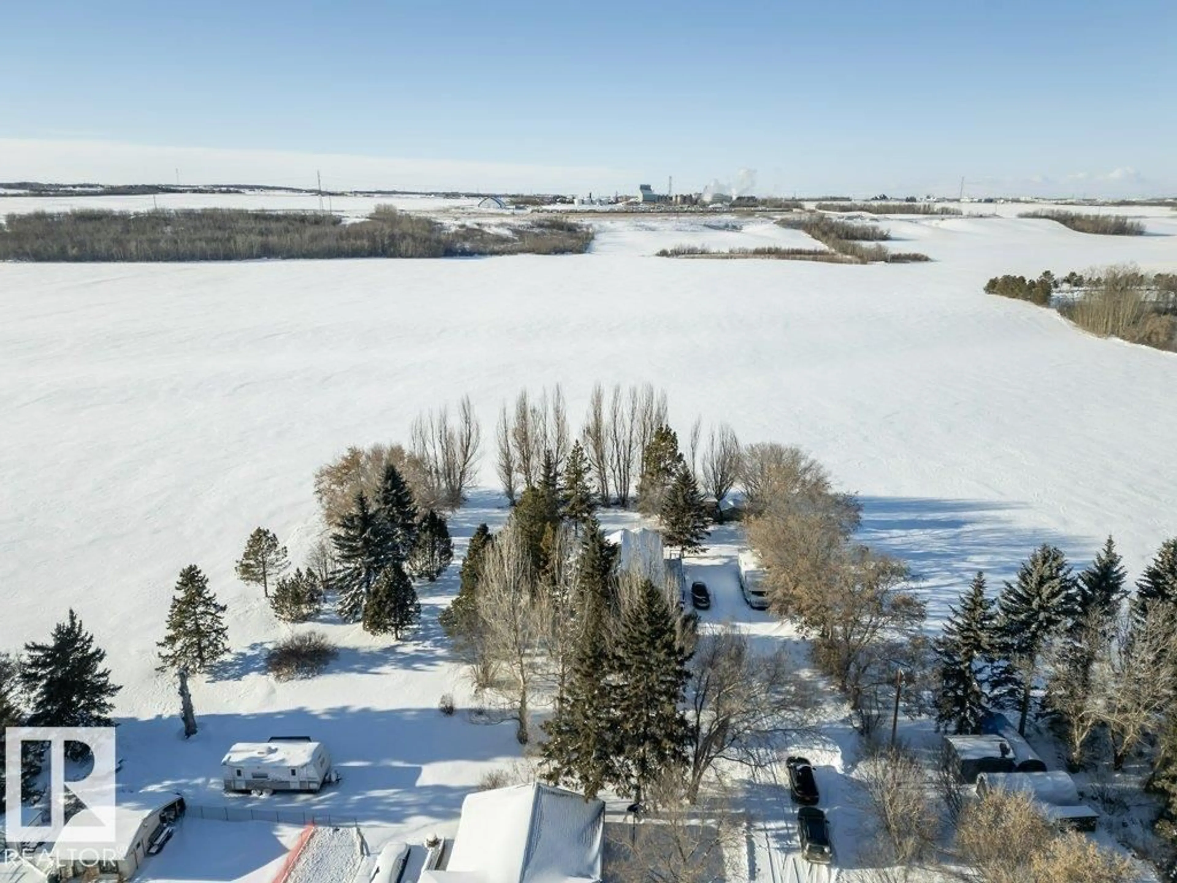 A pic from outside/outdoor area/front of a property/back of a property/a pic from drone, water/lake/river/ocean view for 55000 - 38 LAMOUREUX DR, Rural Sturgeon County Alberta T8L5A7
