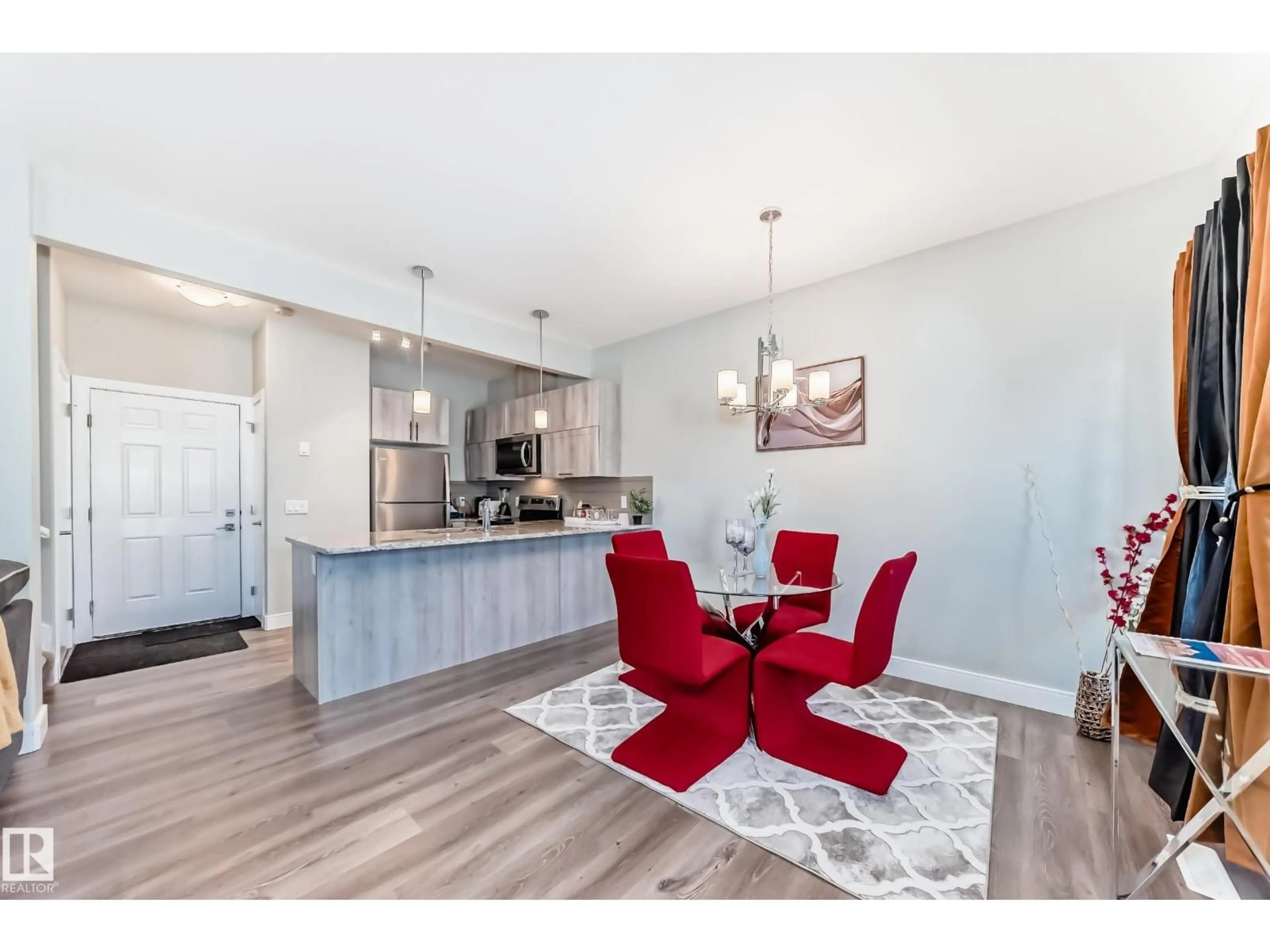 Open concept kitchen, wood/laminate floor for NW - 13145 132 ST, Edmonton Alberta T5E3V1