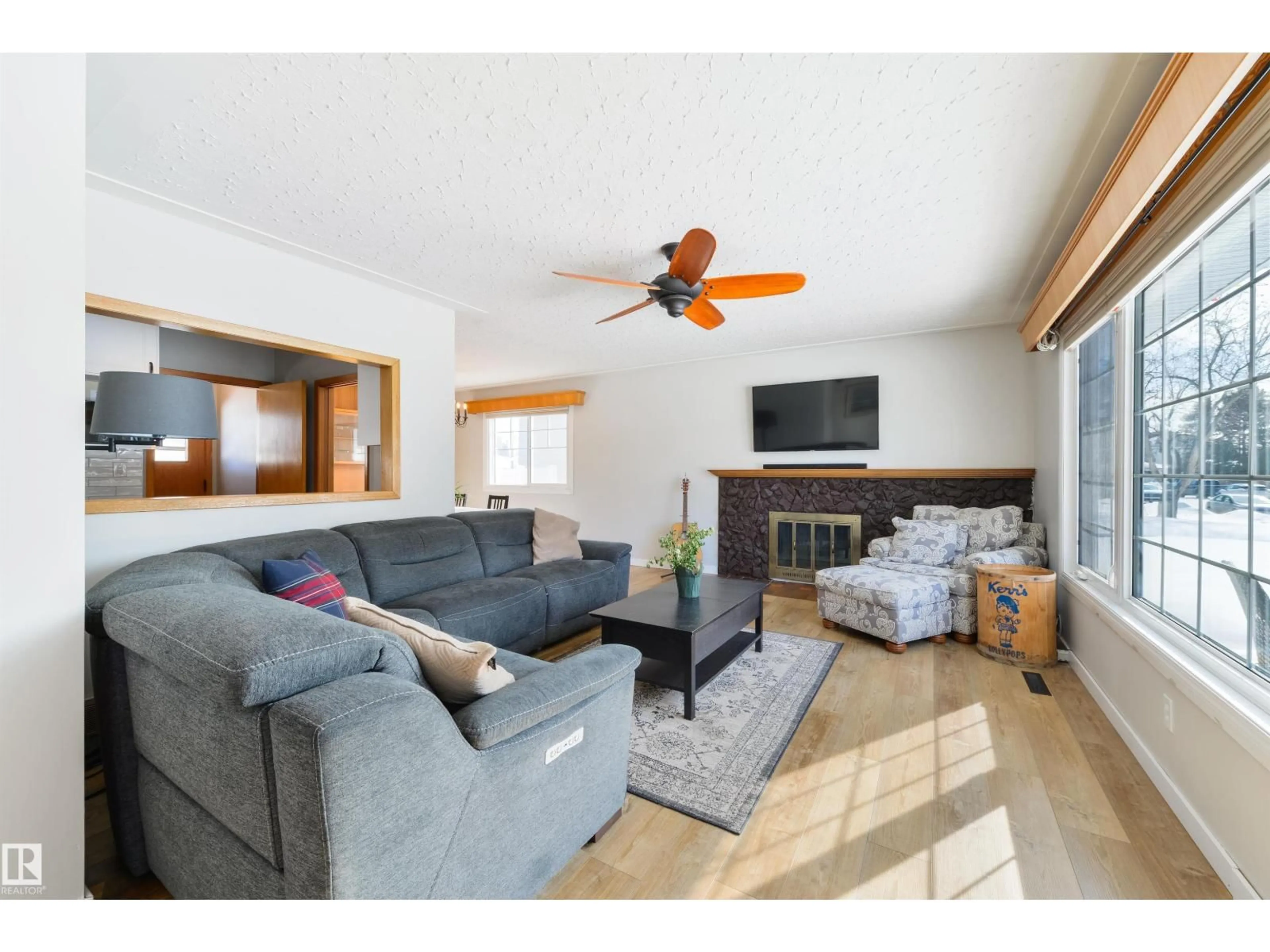 Living room with furniture, wood/laminate floor for NW - 15714 89A AV, Edmonton Alberta T5R4T2