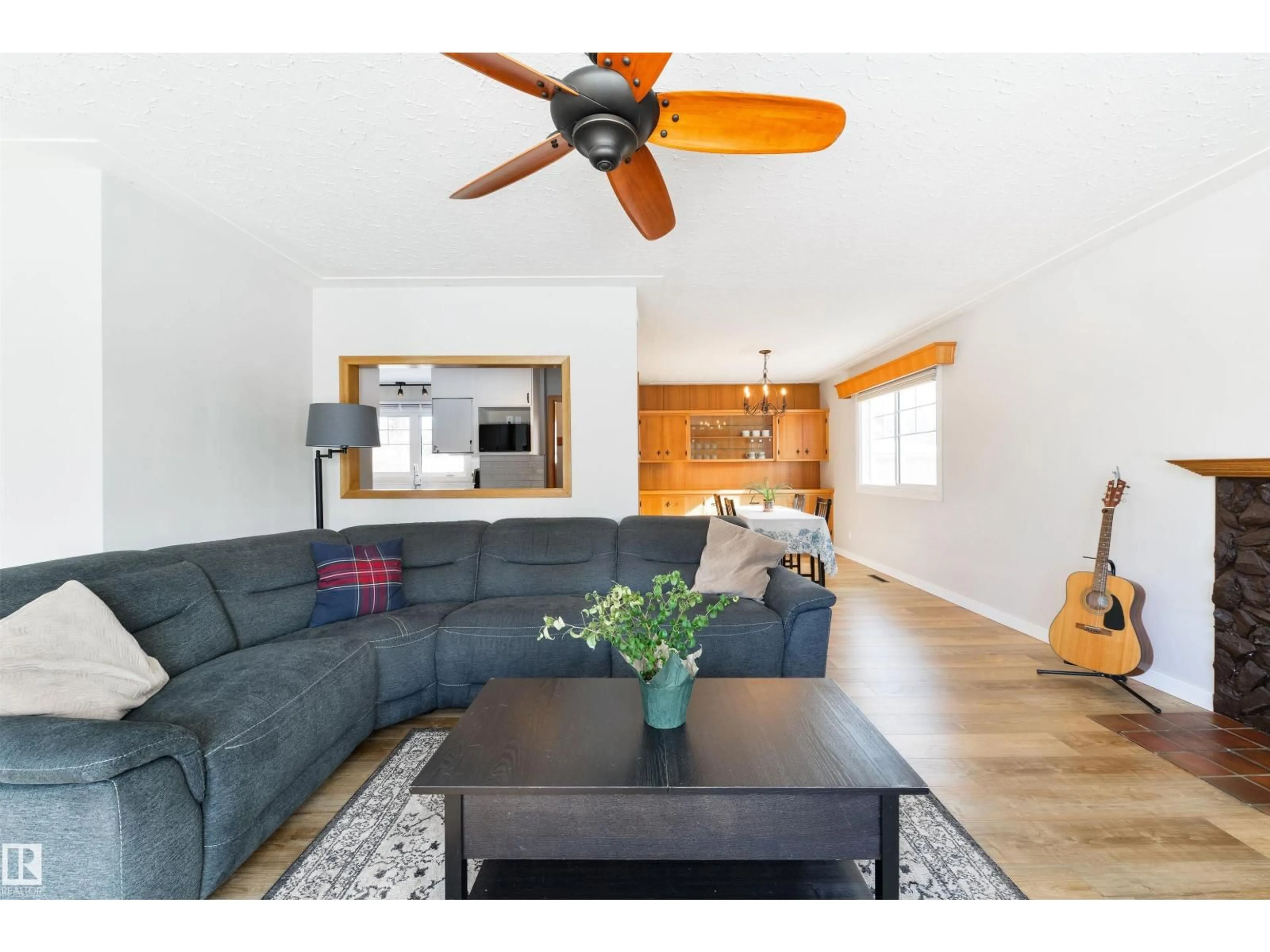 Living room with furniture, wood/laminate floor for NW - 15714 89A AV, Edmonton Alberta T5R4T2