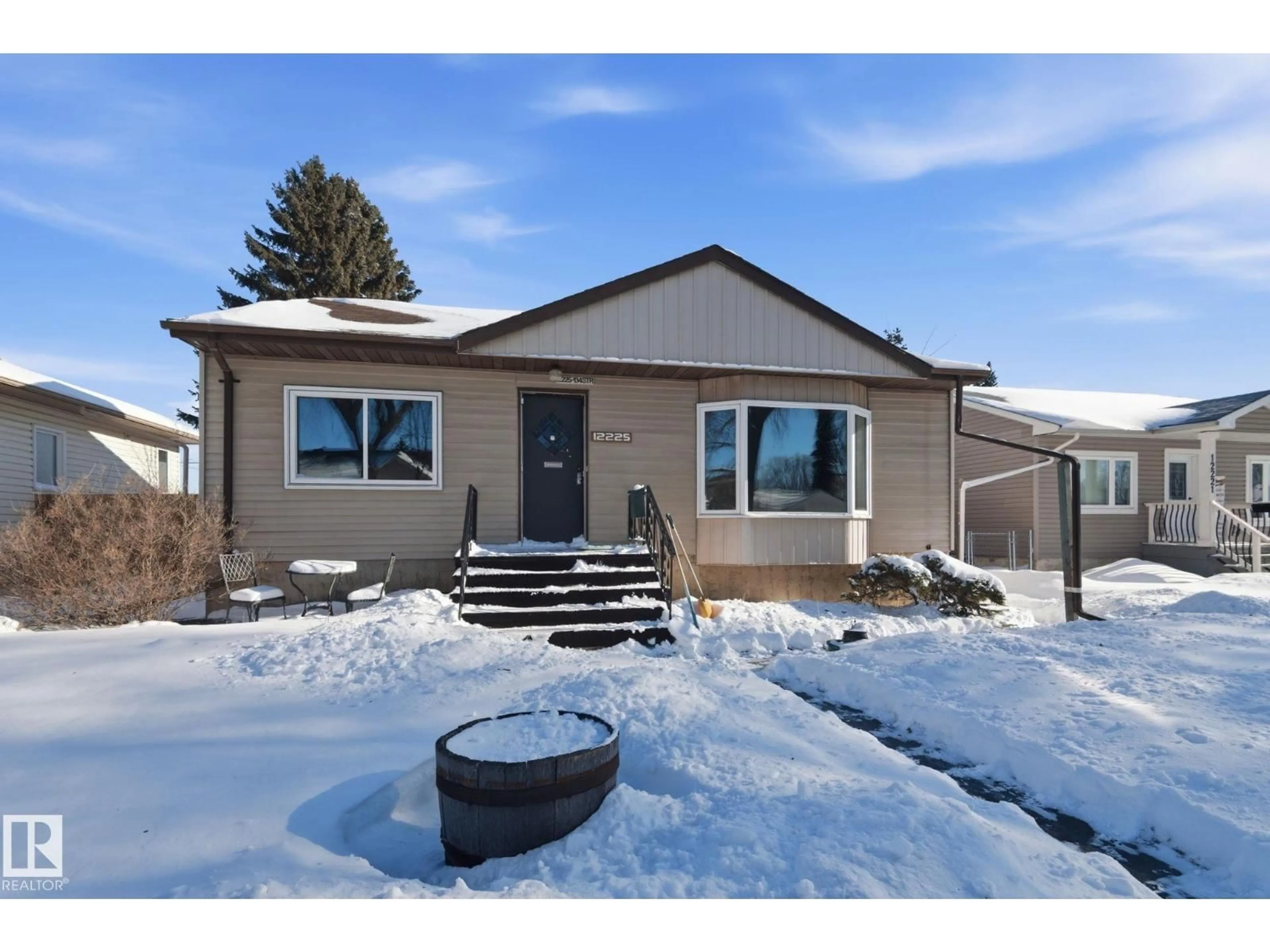 Home with vinyl exterior material, street for NW - 12225 134 ST, Edmonton Alberta T5L1T8