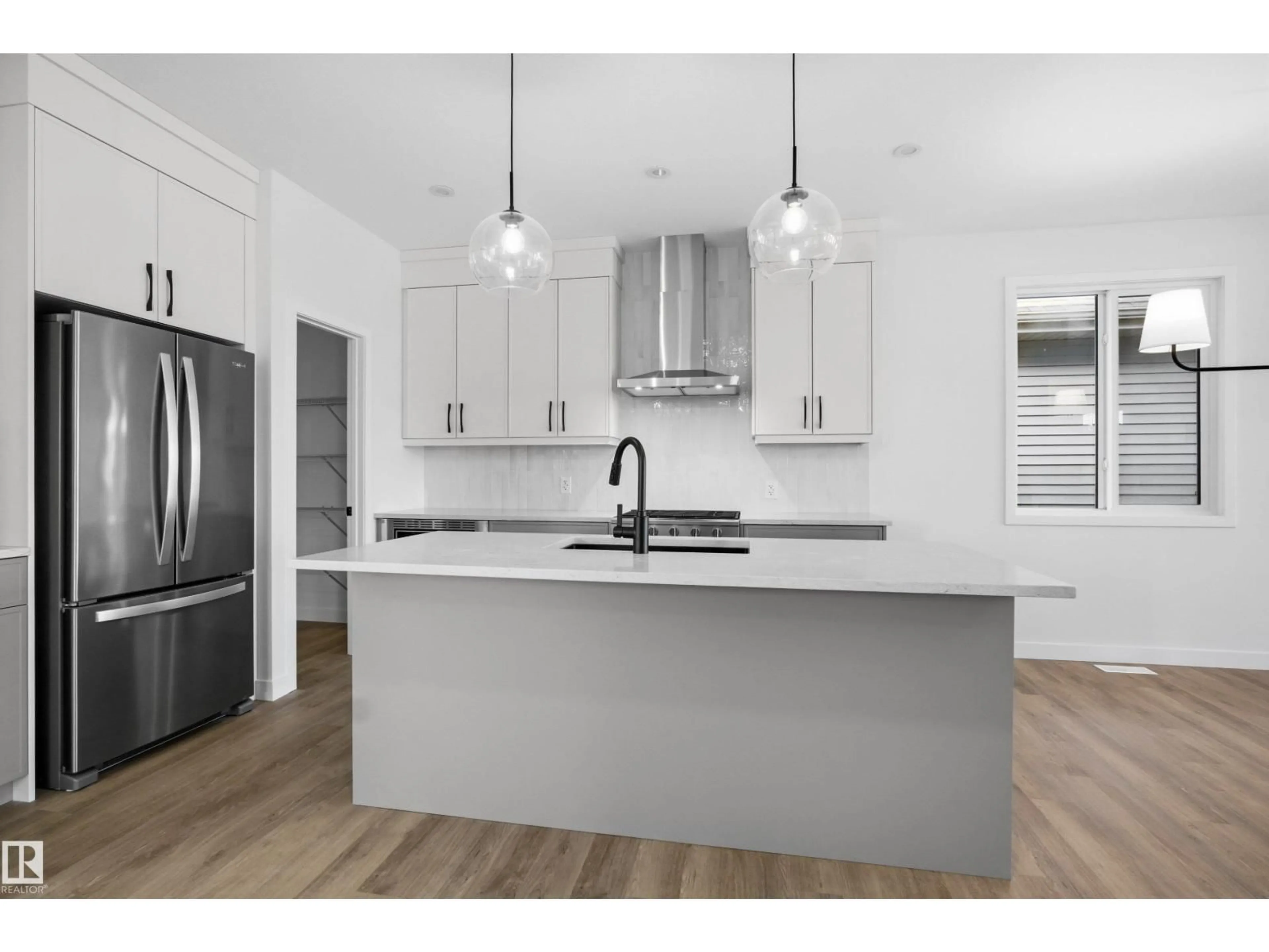 Open concept kitchen, wood/laminate floor for 3704 CROSS LANDING LD, Edmonton Alberta T6W4M8