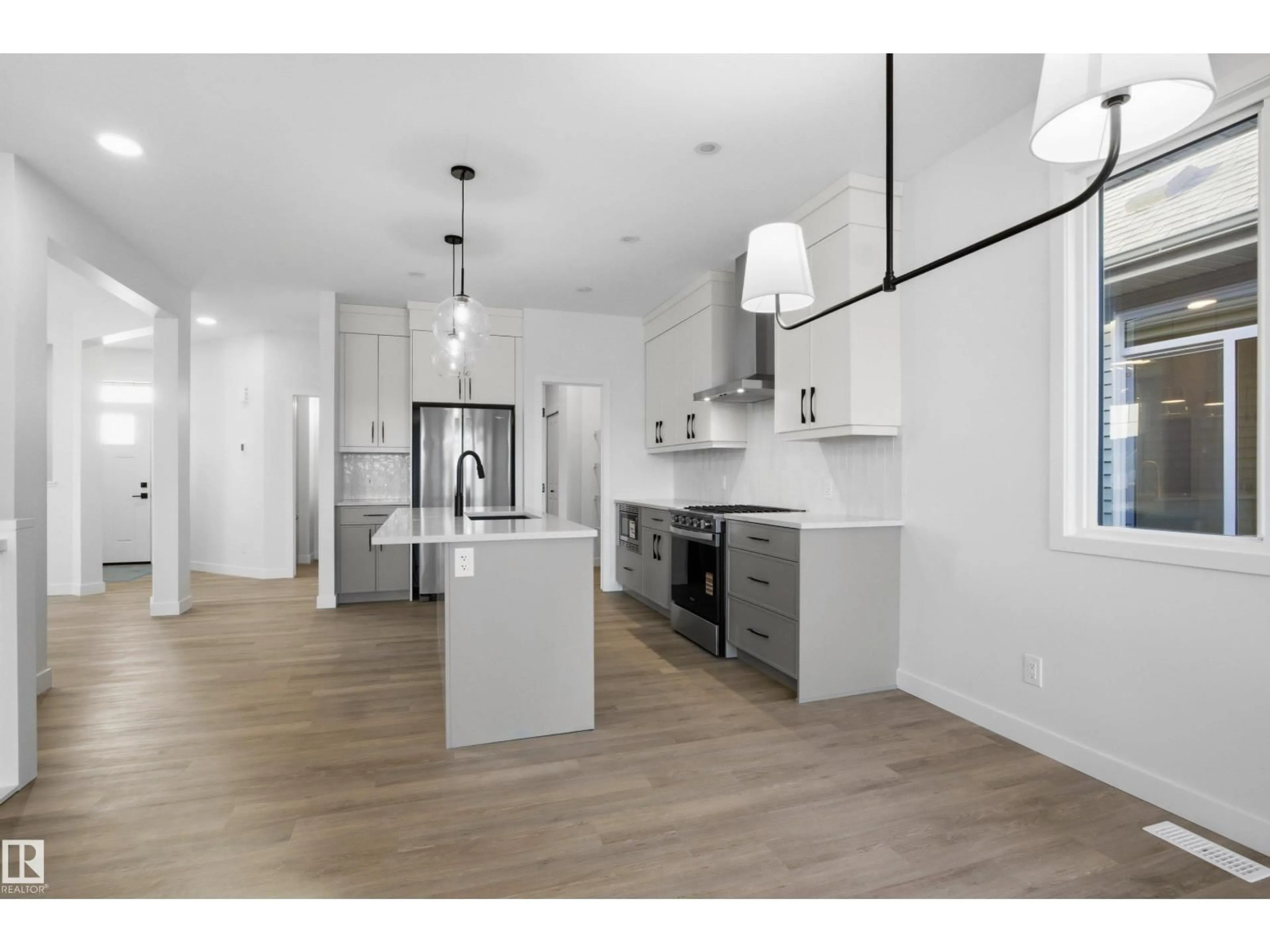 Open concept kitchen, wood/laminate floor for 3704 CROSS LANDING LD, Edmonton Alberta T6W4M8