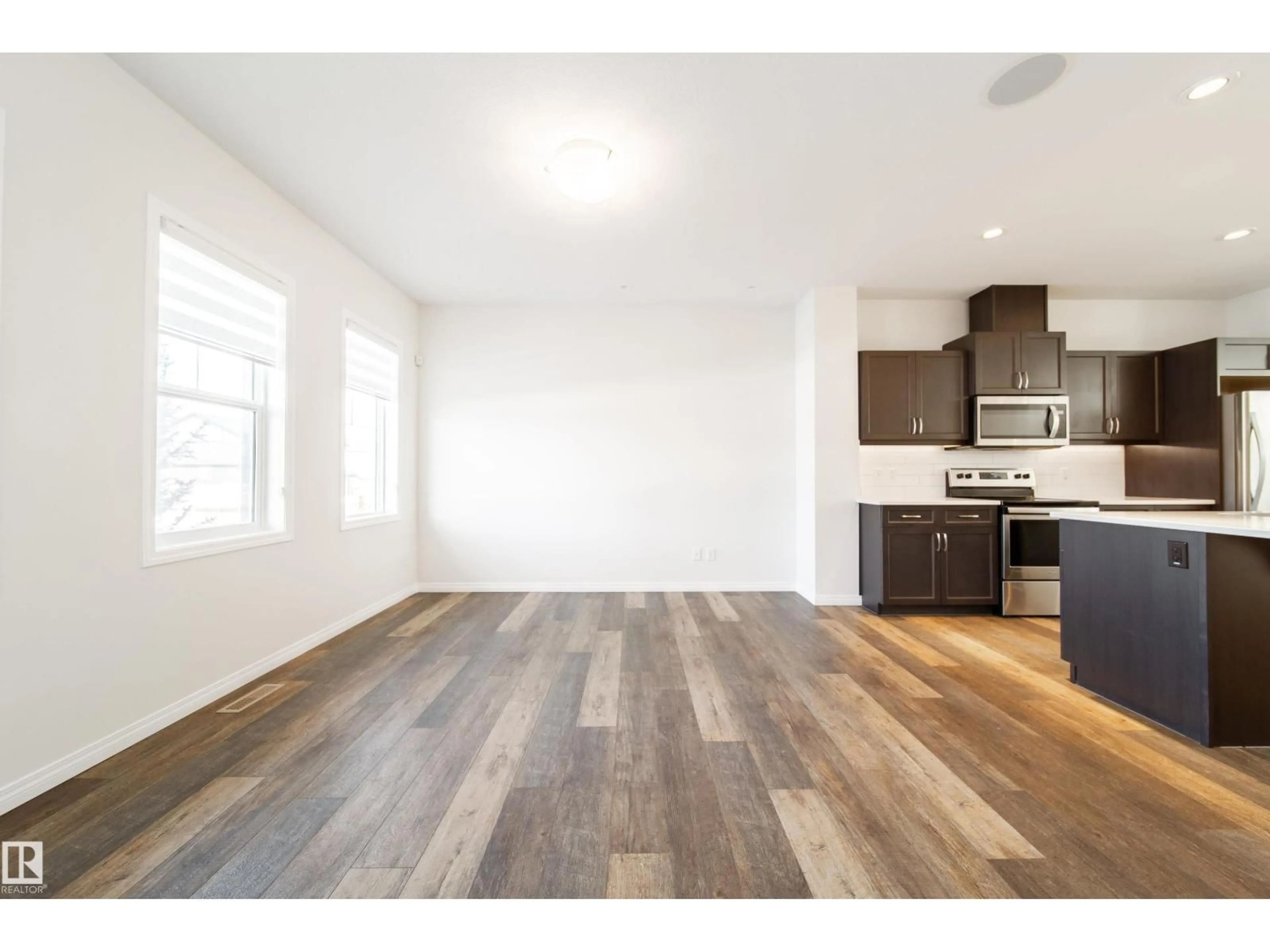 Open concept kitchen, wood/laminate floor for 1199 WATT DR, Edmonton Alberta T6X2P1