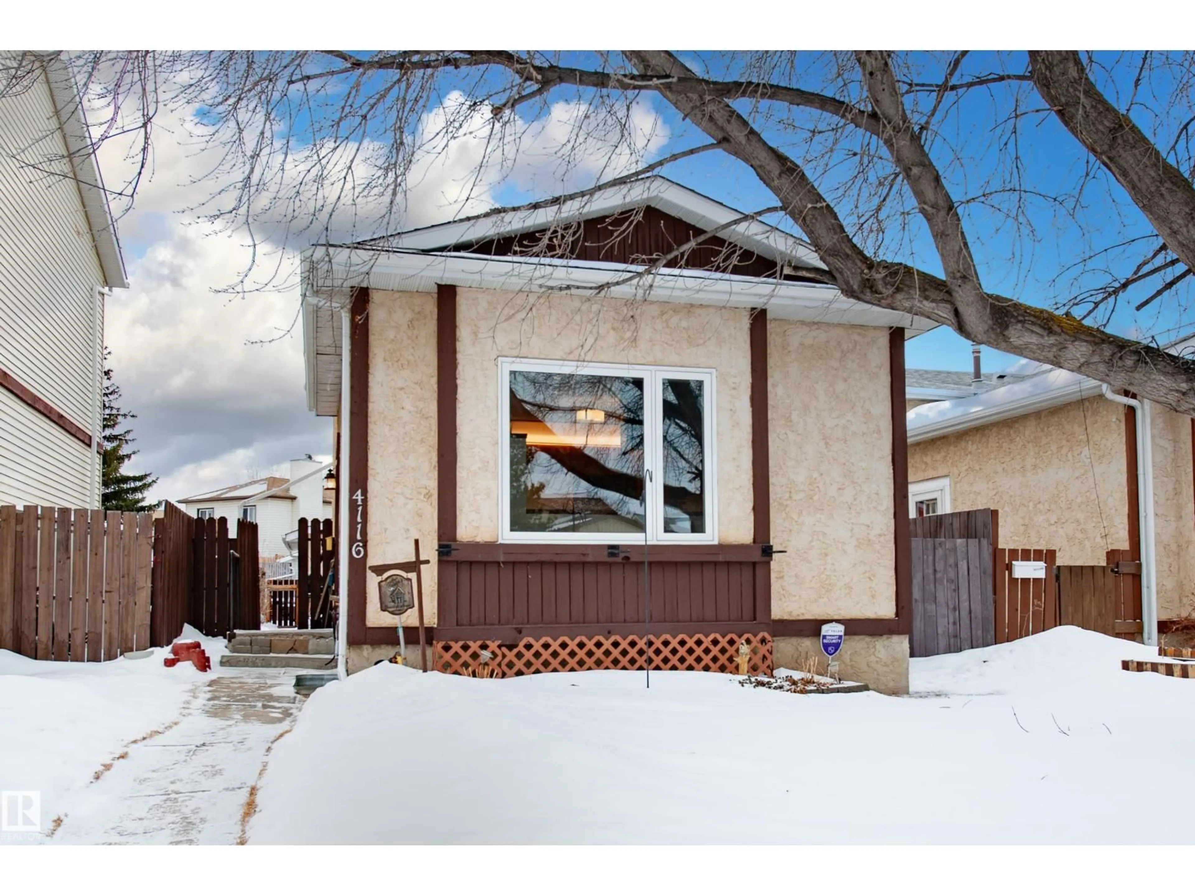 Home with vinyl exterior material, street for NW - 4116 38 ST, Edmonton Alberta T6L5E4