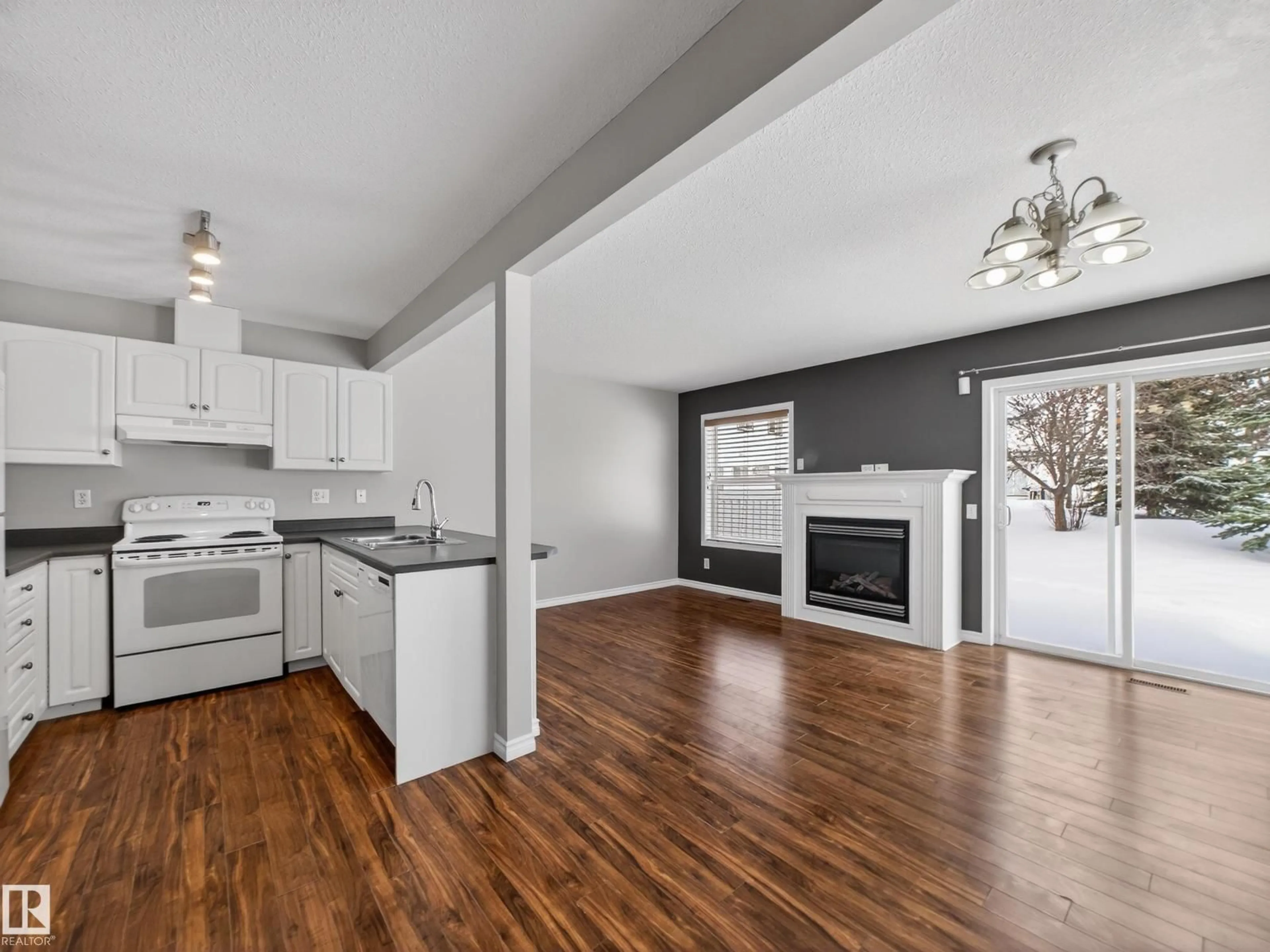 Open concept kitchen, wood/laminate floor for #138 - 16823 84 ST, Edmonton Alberta T5Z3S4