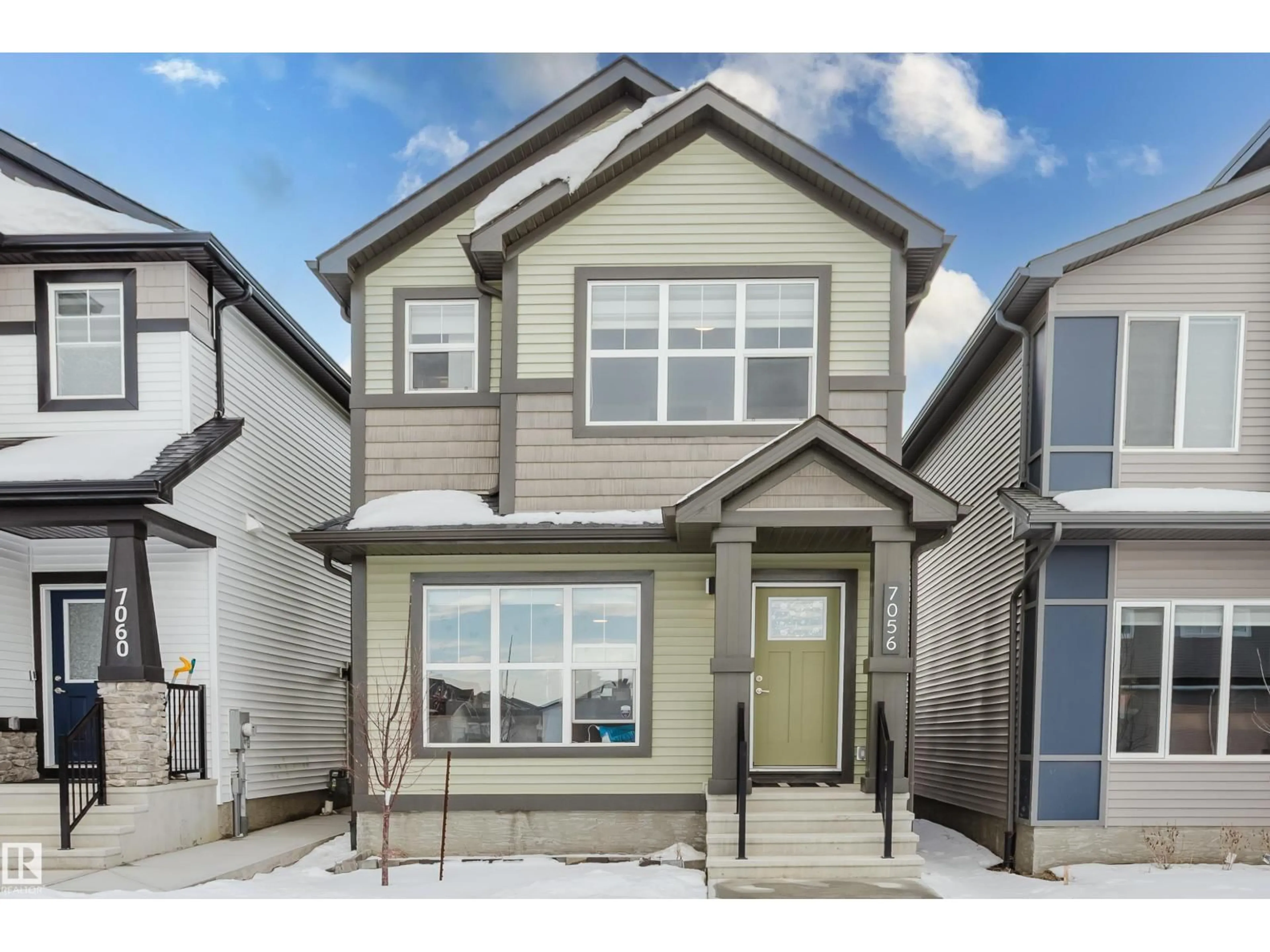 Home with vinyl exterior material, street for 7056 181 AV, Edmonton Alberta T5C0L6