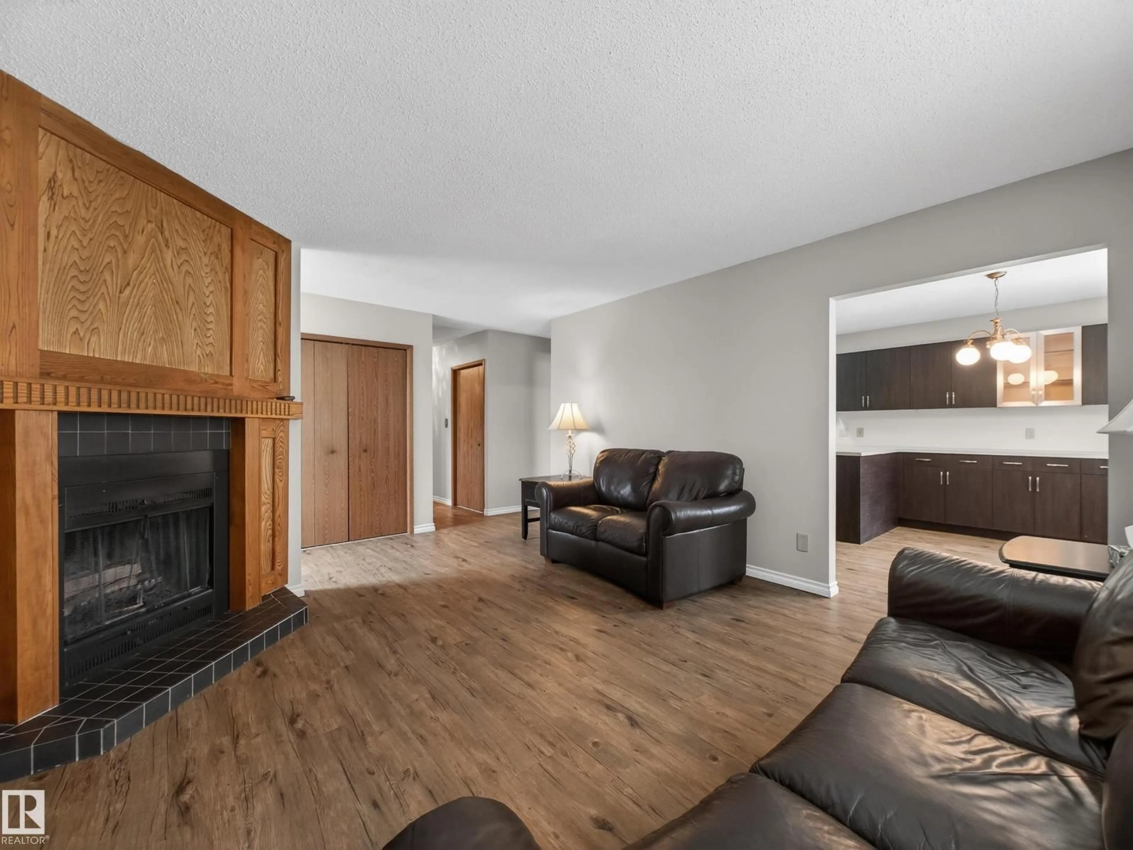 Living room with furniture, wood/laminate floor for 5116 37 AV, Edmonton Alberta T6L1C8