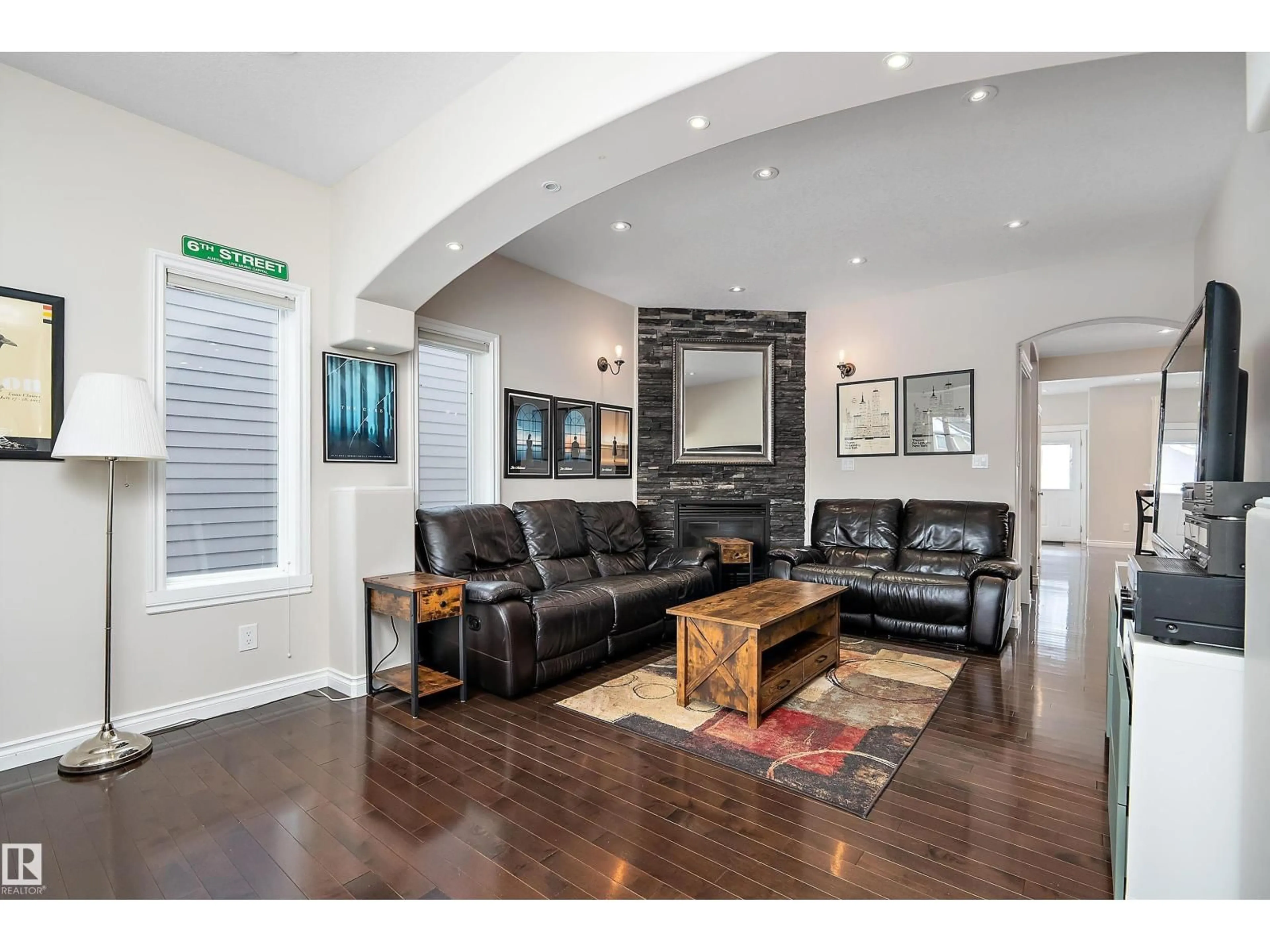 Living room with furniture, wood/laminate floor for 10623 75 AV, Edmonton Alberta T6E1J6