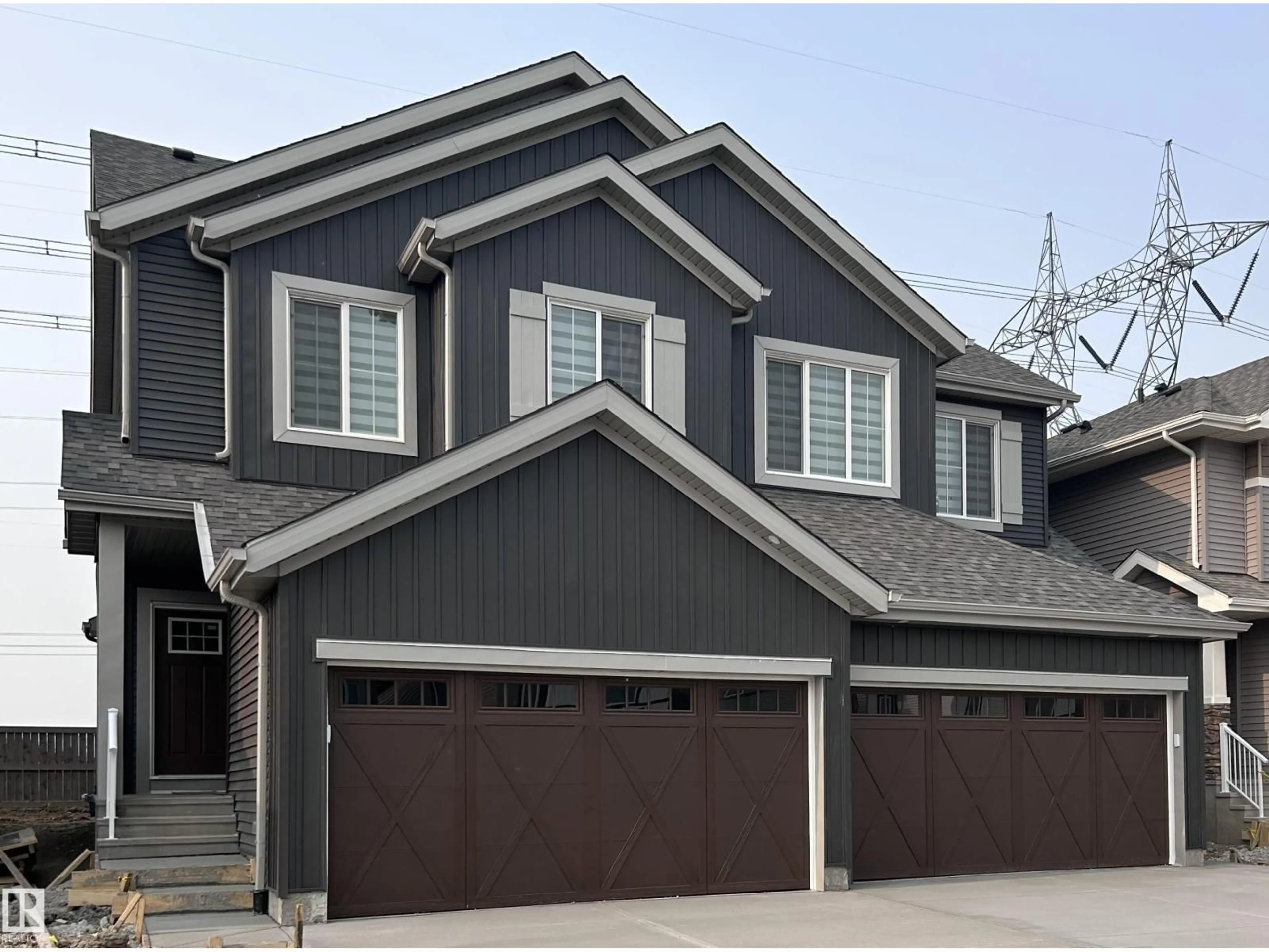 Home with vinyl exterior material, street for 19704 29 AV, Edmonton Alberta T6M1M2